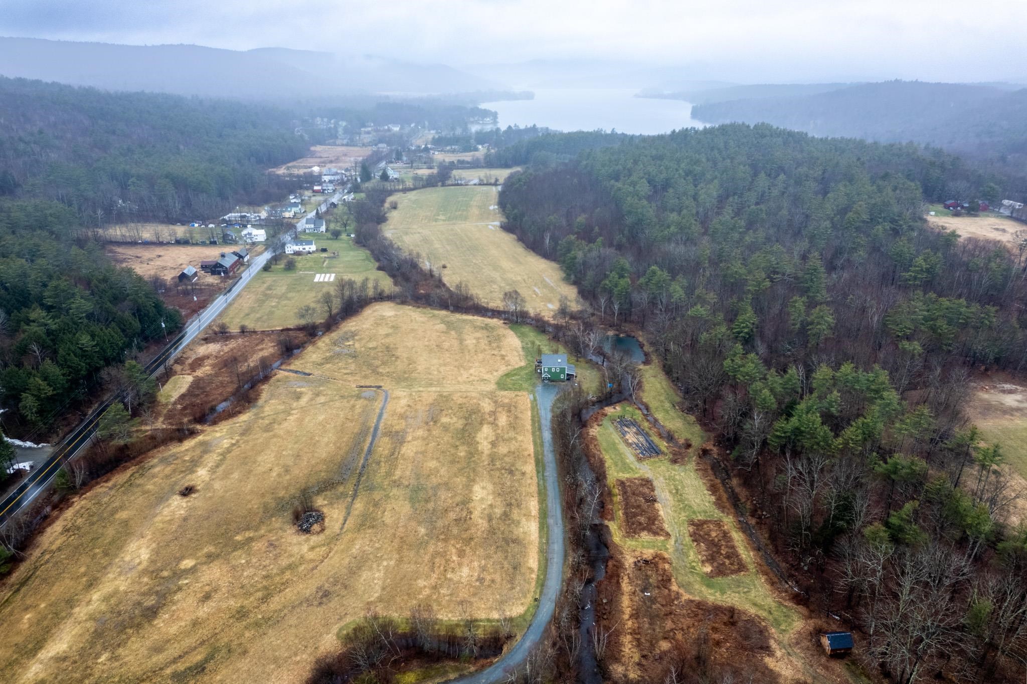 Aerial showing property looking NW towards Mascoma Lake at top of photo