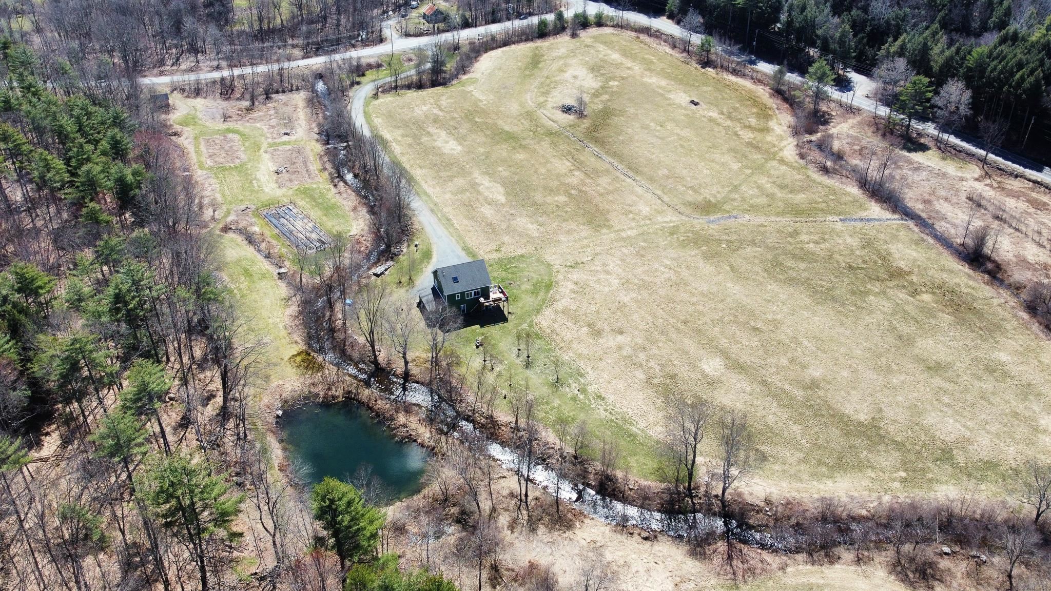 Early Spring aerial shot of property, showing pond and Knox River