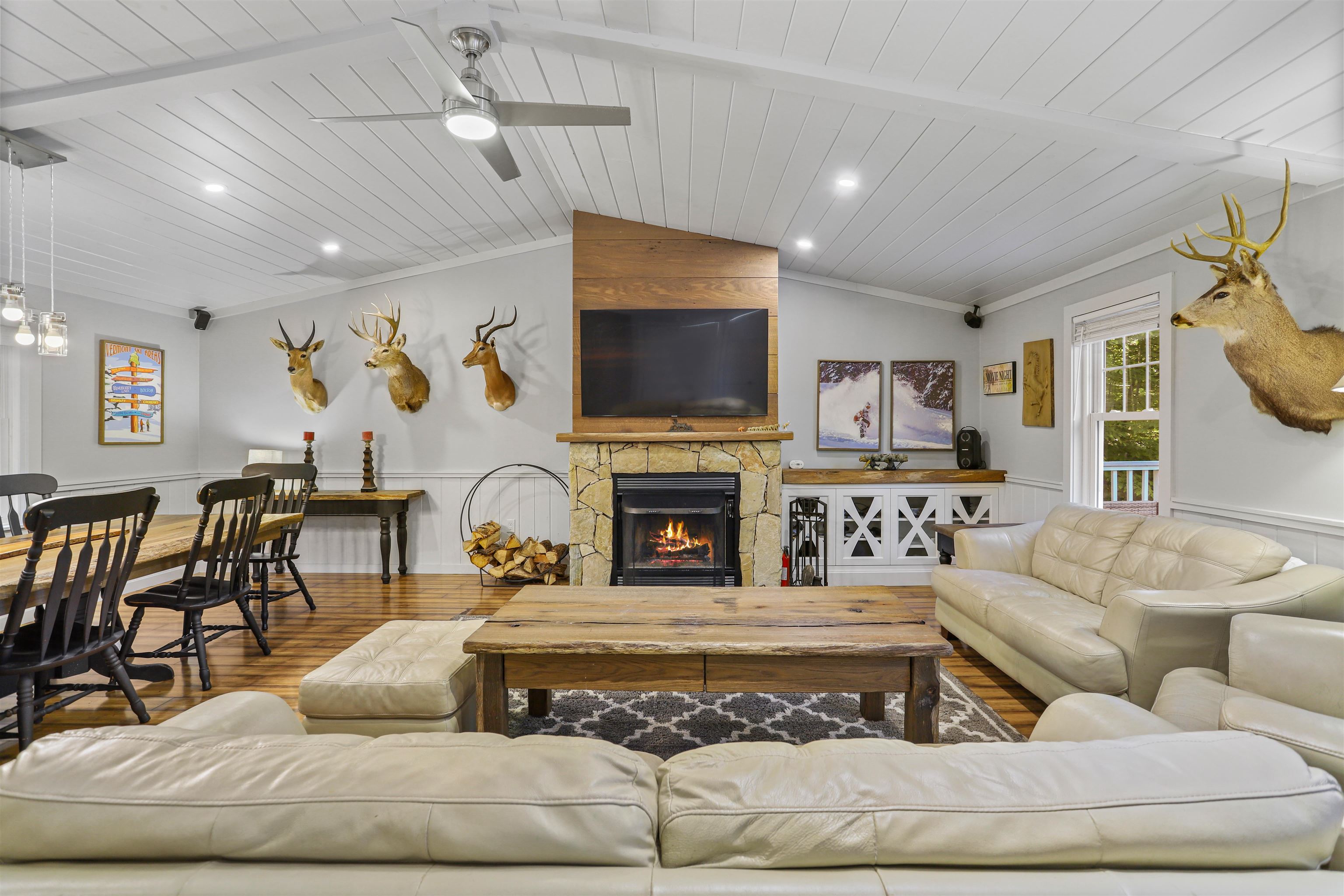 Tastefully renovated home in the desirable Chimney Hill community of Wilmington, Vermont. This open, spacious, bright, and cheery home has been thoughtfully updated. The main living floor features an open-concept layout with tall ceilings and a striking fireplace as the focal point. Three bedrooms and two baths, including a primary suite, complete this level. The lower level offers a cozy family room with a second wood burning  fireplace, multiple overflow sleeping areas, additional bathrooms, and a great entryway with ample storage. Situated on a 1 acre +/- lot with a flat driveway, plenty of parking, and an attached one-car garage, this home is perfect for both primary living and vacation getaways. Community amenities include a large outdoor pool, an indoor pool, a gym, media and recreation spaces, tennis courts, basketball courts, a community-stocked fishing pond, and trail system. Harriman Reservoir boat launch and marina, ideal for boating, swimming, and lake recreation, are just minutes away, as is downtown Wilmington with its charming shops, dining, and entertainment options. Multiple ski mountains are also a short drive away. This home is move-in ready and an excellent choice for those seeking a primary residence or a vacation retreat.