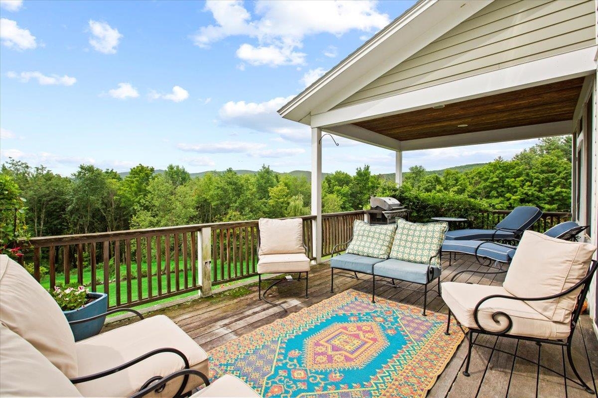 Deck with mountain views overlooks the garden