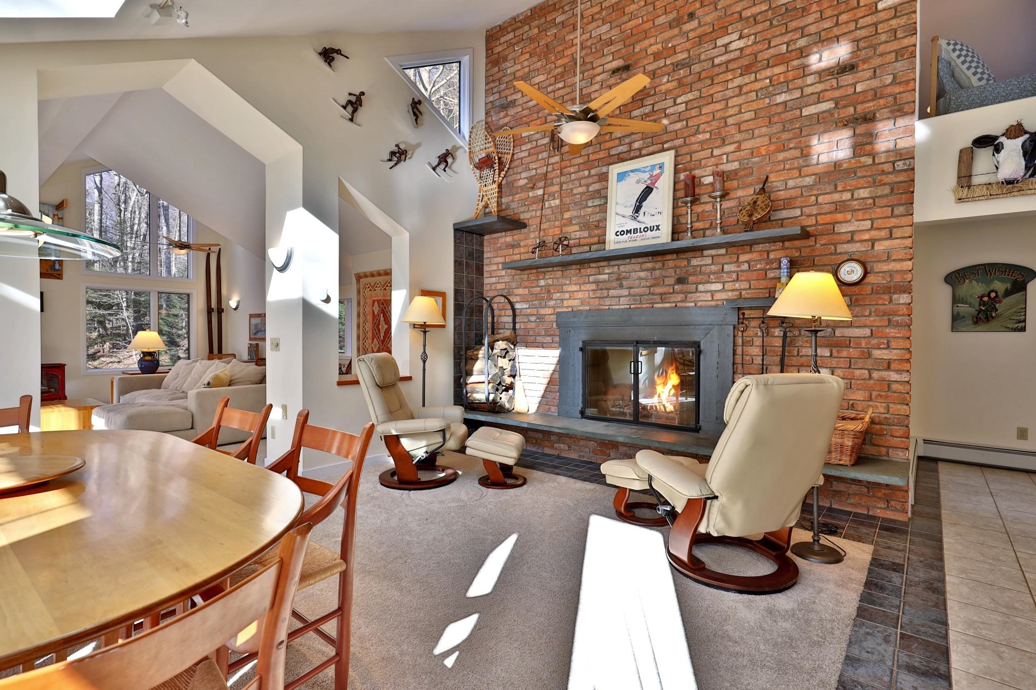 Dining Area with Floor-to-Ceiling Brick Fireplace