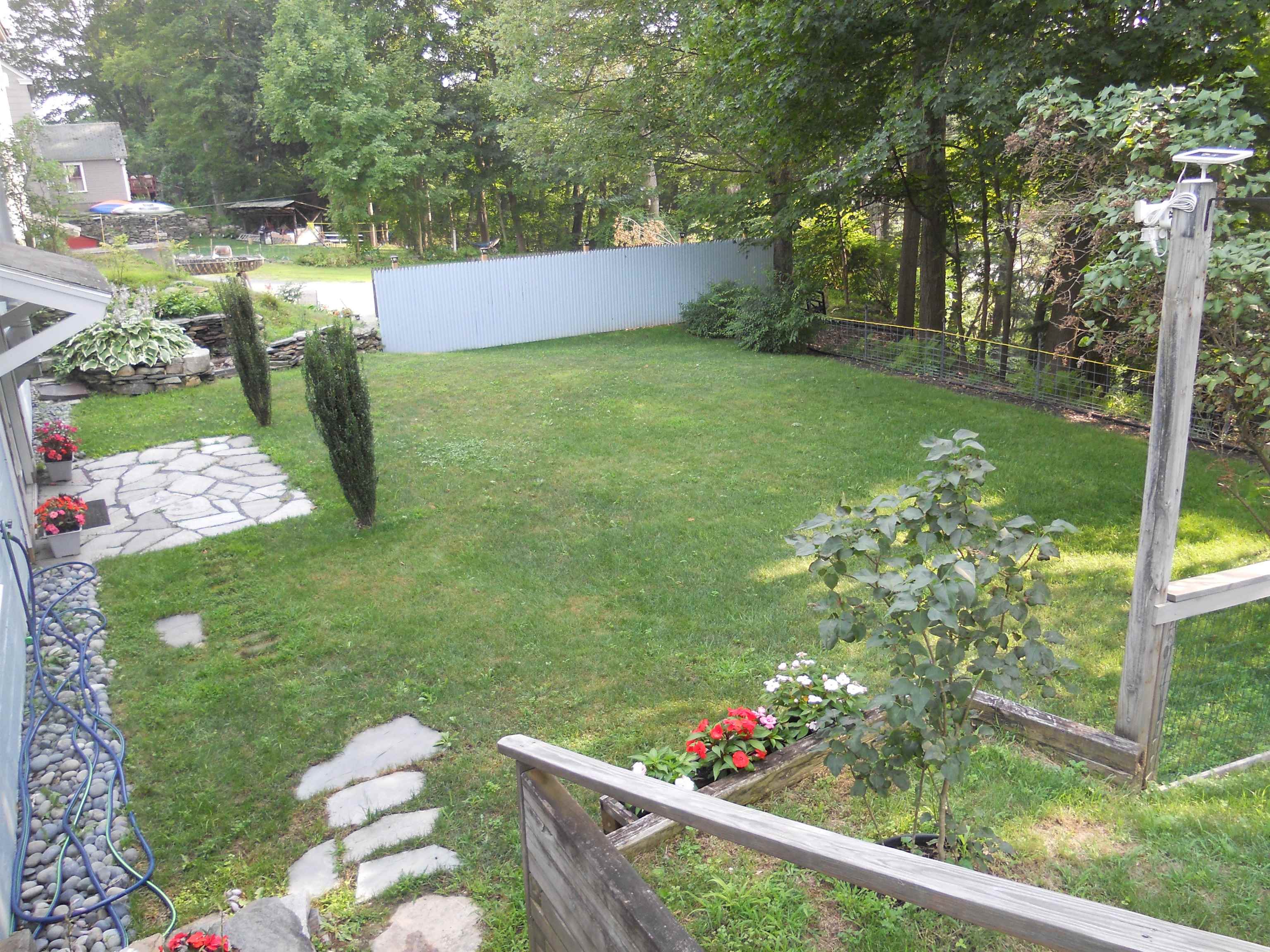 Steps Down to Spacious Back Yard