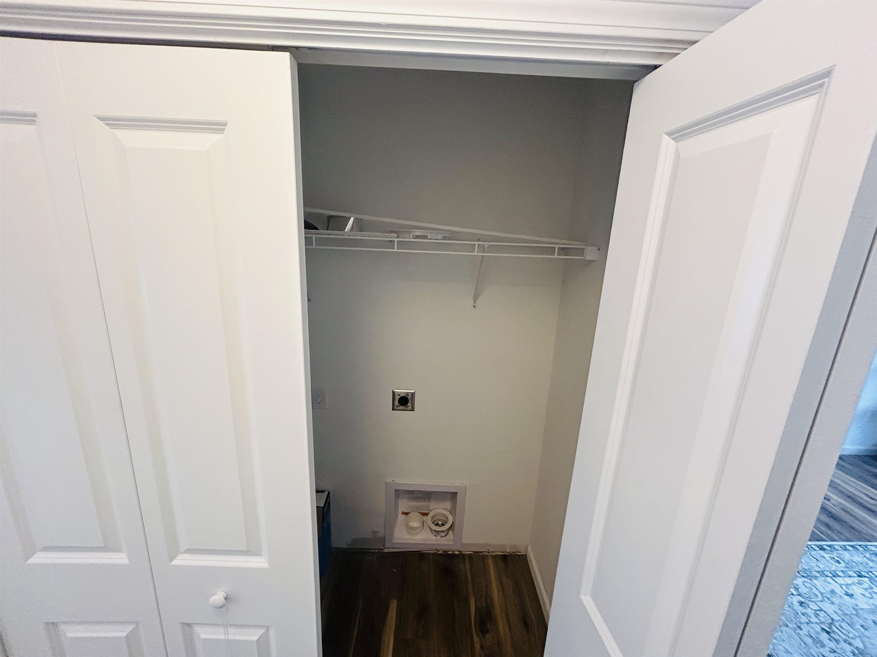 Washer and dryer closet off primary bedroom on first floor