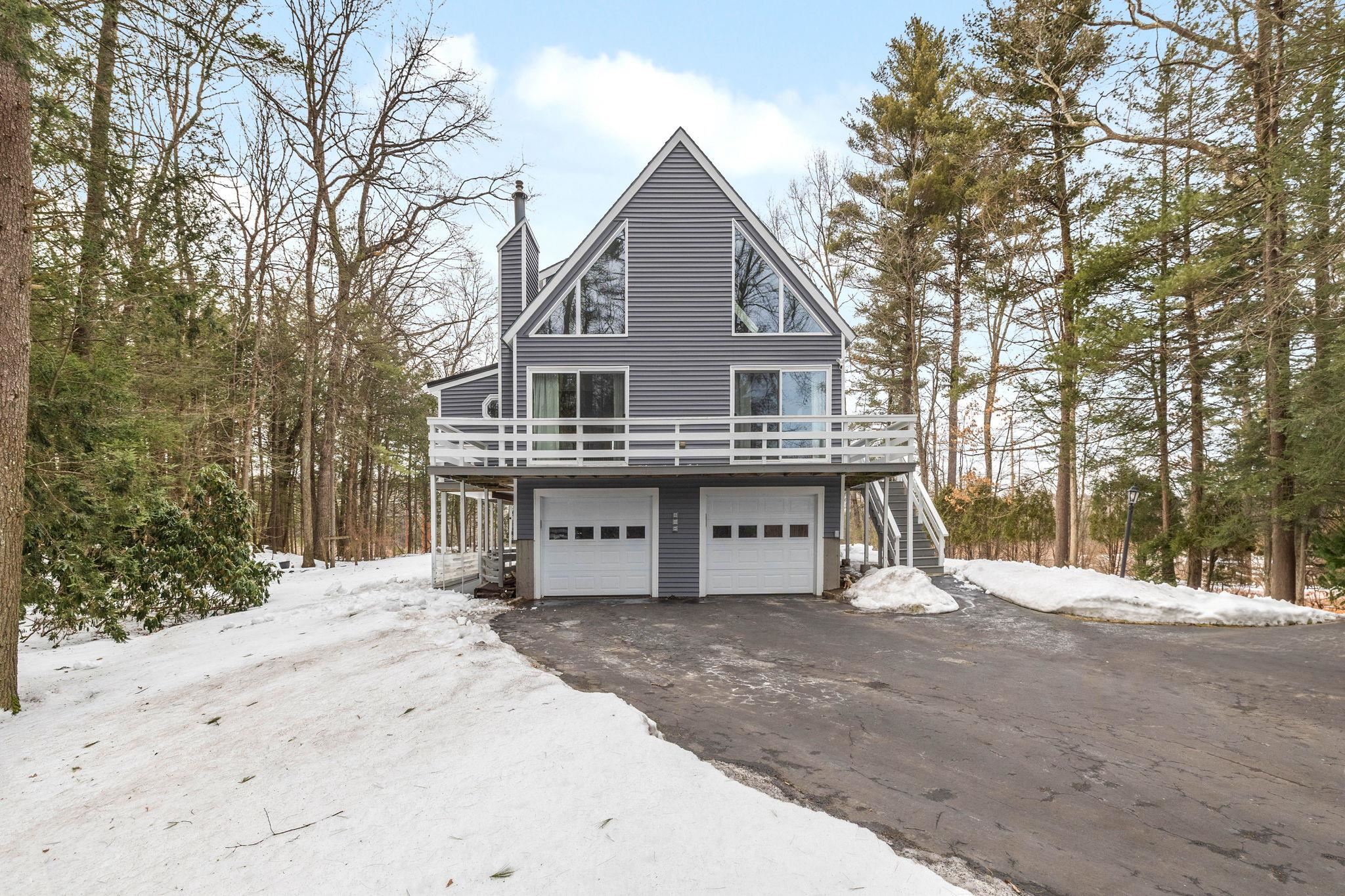 Stunning Contemporary Home on 1.96 Acres – 12 Season Lane, Londonderry, NH. Nestled on a serene 1.96-acre lot, this 1,768 sq. ft. contemporary home offers the perfect blend of privacy, style, and comfort. Located in the desirable town of Londonderry, NH, this unique property boasts a bright and airy open-concept design, ideal for modern living. Step inside to find soaring ceilings, expansive windows, and warm natural light filling the living spaces. The inviting living room features a fieldstone fireplace with pellet insert, perfect for relaxing on cool New England nights. The kitchen offers ample cabinetry and counter space, flowing seamlessly into the dining area—ideal for entertaining. Upstairs, the primary suite provides a tranquil retreat, while additional bedrooms offer flexibility for family, guests, or a home office. Outside, enjoy the beauty of nature and mature trees surrounding the property, creating a peaceful oasis. Conveniently located near top-rated schools, shopping, dining, and major highways, this home combines the best of private living with easy access to everyday amenities. Don't miss your chance to own this beautiful contemporary gem in Londonderry!