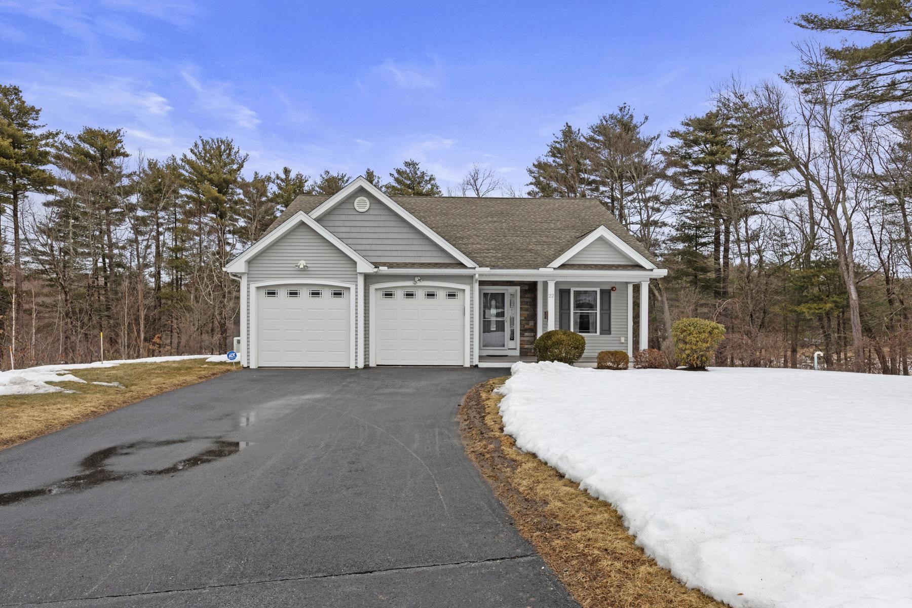 Paradise Estates, Pelham NH! Loaded with upgrades, you will enjoy one level living in this 55+ adult community! This home features a custom kitchen with granite countertops and stainless steel appliances, as well as gorgeous cherry hardwood floors throughout. The sunroom, master bedroom, & living room boast cathedral ceilings, with the living room also featuring a cozy gas fireplace.The master bedroom includes an oversized tiled bathroom. Additional highlights include central AC, interior safety sprinklers, a front porch and a large back deck overlooking the woods. The exterior features lawn irrigation, a community clubhouse. A full basement with a walkout  and large windows is partially finished and has a stair lift. The home includes a full-house generator, and an attached two car garage, with upgraded shelving, and epoxy flooring. Minutes to shopping, highways, and local conveniences. No landscaping or plowing required! Located at the end of a cul-de-sac, this is a wonderful opportunity!