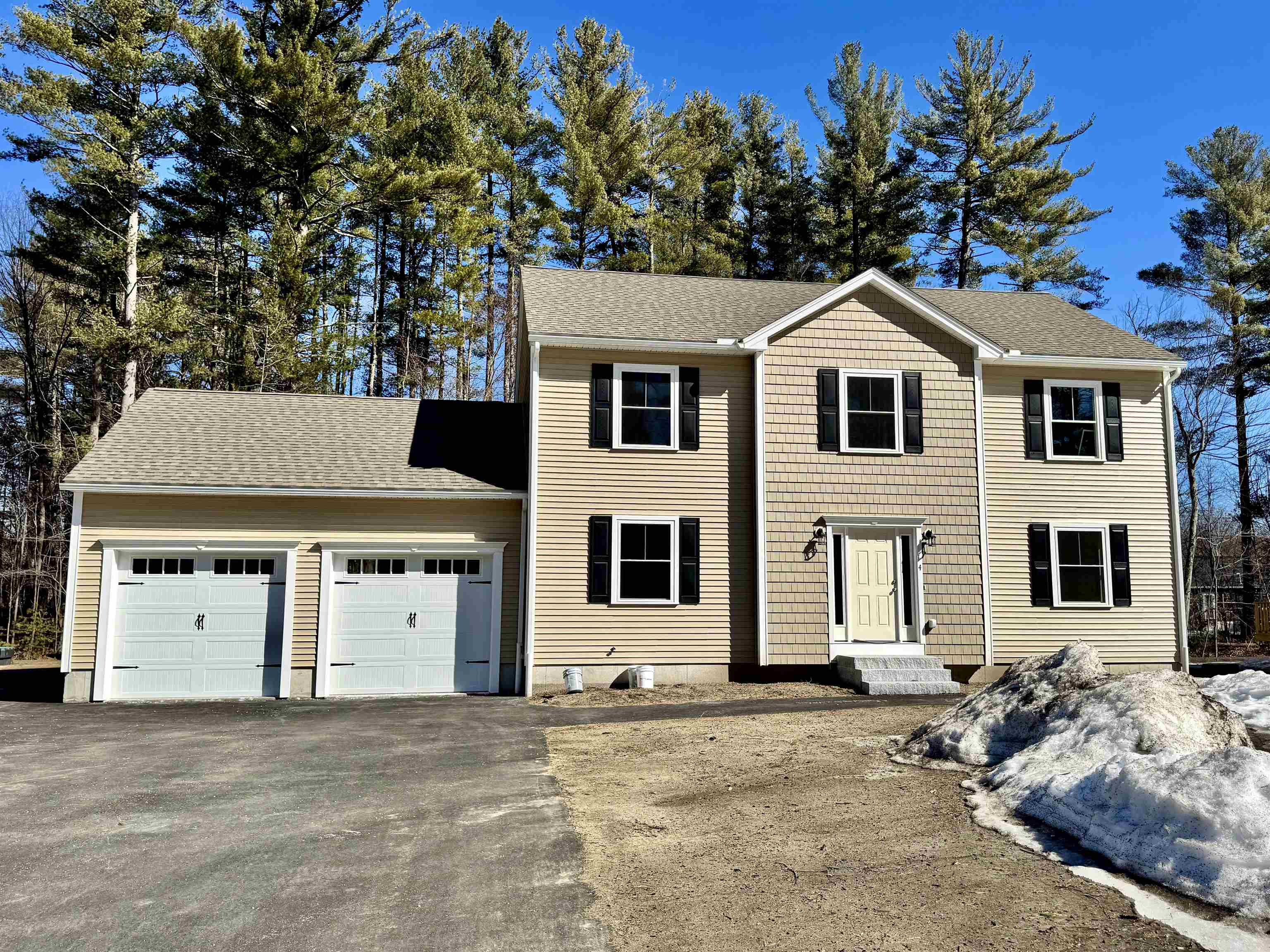 LAST ONE AVAILABLE, MOVE-IN READY!! This gorgeous 4BR/3BA colonial, nestled in a private development off of W Hollis St in Nashua, boasting modern amenities and timeless elegance, this home is perfect for families seeking comfort, style, and convenience. The open-concept floor plan offers ample space for entertaining and family gatherings, with a seamless flow between the expansive living area, gorgeous dining area, and kitchen, with gleaming hardwood floors throughout and a beautiful gas fireplace. The incredible kitchen features granite countertops, stainless steel appliances, custom cabinetry, and a large island, with a separate kitchen dining area that looks out double sliders onto the large wood deck and spacious backyard. Head upstairs to the expansive master bedroom, that includes a walk-in closet and and en-suite bathroom. Additionally, there are three generously-sized bedrooms with large closets all sharing a beautifully appointed bathroom, as well as a convenient 2nd floor laundry area. The unfinished basement is a blank canvas for more potential living space. The attached 2-Car Garage provides ample storage and easy entry to the home. Located just off Everett Turnpike, close to schools, shopping, dining, it makes commuting and convenience a breeze. Built with the best energy-efficient systems, it'll ensure comfort and savings on utility bills. DO NOT MISS THIS INCREDIBLE HOME!