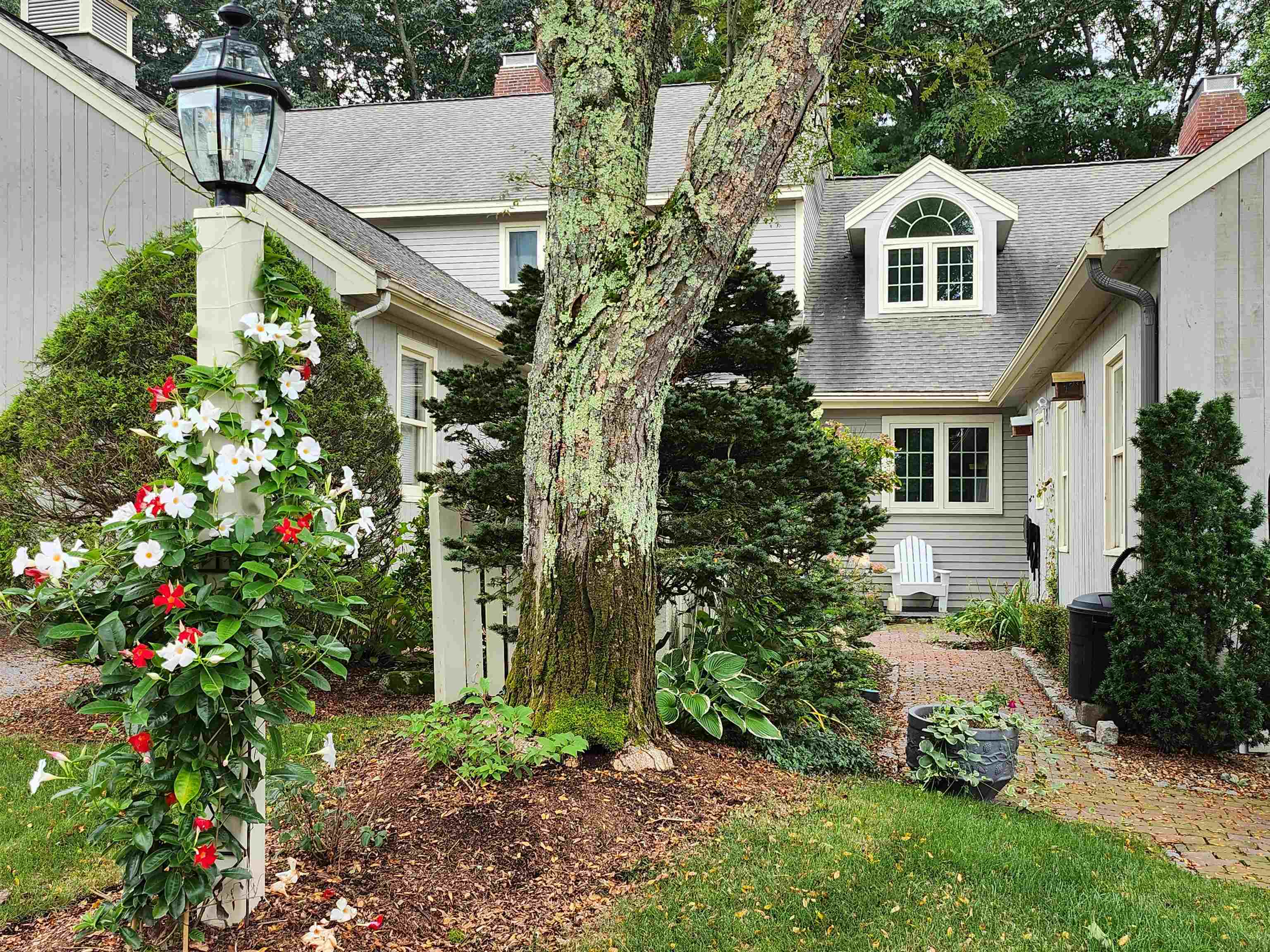 Welcome to Windham Village Condominium! Nestled in the prime center of Windham, no age restriction, a self managing association,  quiet & highly desirable neighborhood.  This stunning property offers the perfect combination of comfort and modern upgrades.  The upgrades are total renovations of the interior but also include the mechanical components, like furnace, A/C unit, water softener, hot water tank, oil tank & electrical panel.  Also some windows, skylight + more.    Step inside to discover first-floor living at its finest, with a highlighted custom kitchen with top of the line quartz countertops. An open concept LR w/wood burning FP and family gathering dining room.  The 1st floor primary suite offers a vaulted ceiling, shower bathroom w/quartz countertops & two closets (one walk-in).  There's a powder room that has a granite sink top.  The upstairs has another primary suite with a bathroom & a walk-in closet.  The walk-out lower level has an office w/built in shelves, closets and a bedroom w/ bathroom w/quartz countertops.  Both the first and second levels have hardwood floors.    The tree lined backyard offers privacy & a serene space for relaxation. The spacious brick patio & back deck is ideal for entertaining friends and family.   Showings start from Saturday 3/15/2025 12pm-3pm and Sunday 3/16/2025 12pm-2pm.