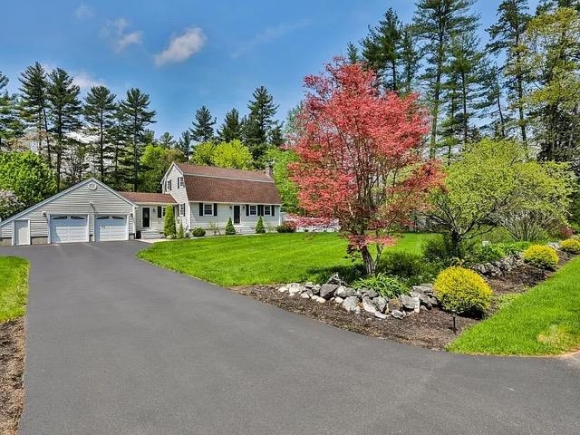 Impeccably maintained home in a desirable Merrimack subdivision. Welcome to this spacious home, offering modern updates and a versatile first-floor bedroom or office. You'll appreciate the pretty landscaping, stone walkways, and granite steps when you arrive. Updated kitchen with abundant cabinets extending to the ceiling, granite countertops, a gas stove, and stainless steel appliances, dining room or use it for a den, four-season sunroom with expansive windows overlooking the backyard. Recessed lighting, with a bright, and inviting feel. The living room offers hardwood floors and a cozy gas fireplace. Recently renovated 3/4 bath featuring a stunning tile shower. The second level offers three additional spacious bedrooms, a newly renovated full bath, and a primary bedroom with double closets. The Finished basement provides extra living space, a family room, and a bar area, perfect for gatherings. Outside is an outdoor oasis. A private retreat with a large deck, patio, and flat yard with just under 1 acre of land. Hot tub and stone fire-pit for year-round enjoyment. Above-ground pool for summer fun, fully fenced yard with a storage shed for convenience.  Additional features: On-demand whole house generator, irrigation system, all major systems updated over the years. Prime location with easy access to highways, trails, perfect for commuters. Don't miss this meticulous home, ready for its next owners! Sellers relocating. showings start Wednesday, Open Saturday from 12-2 pm
