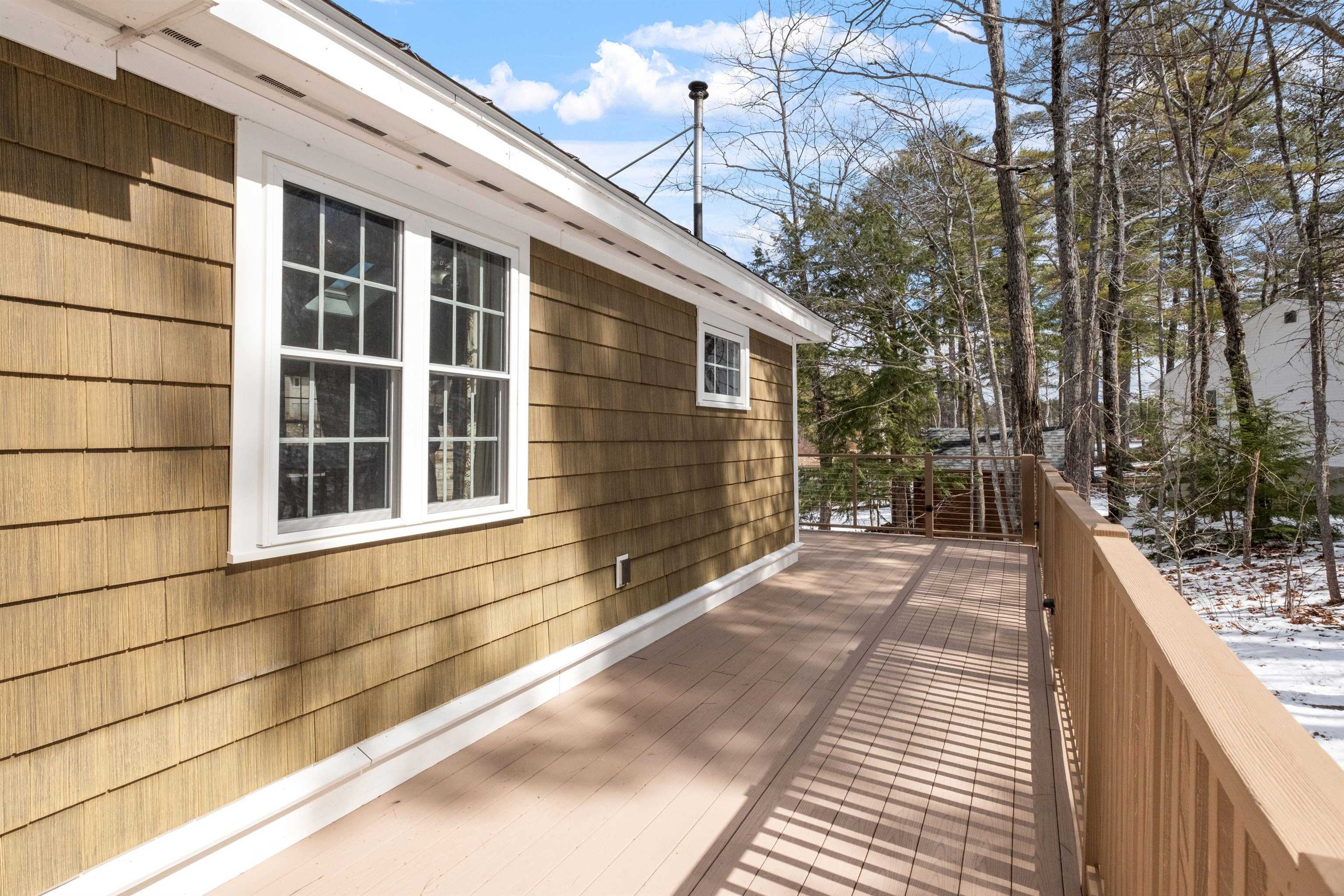 Wrap around main floor composite deck
