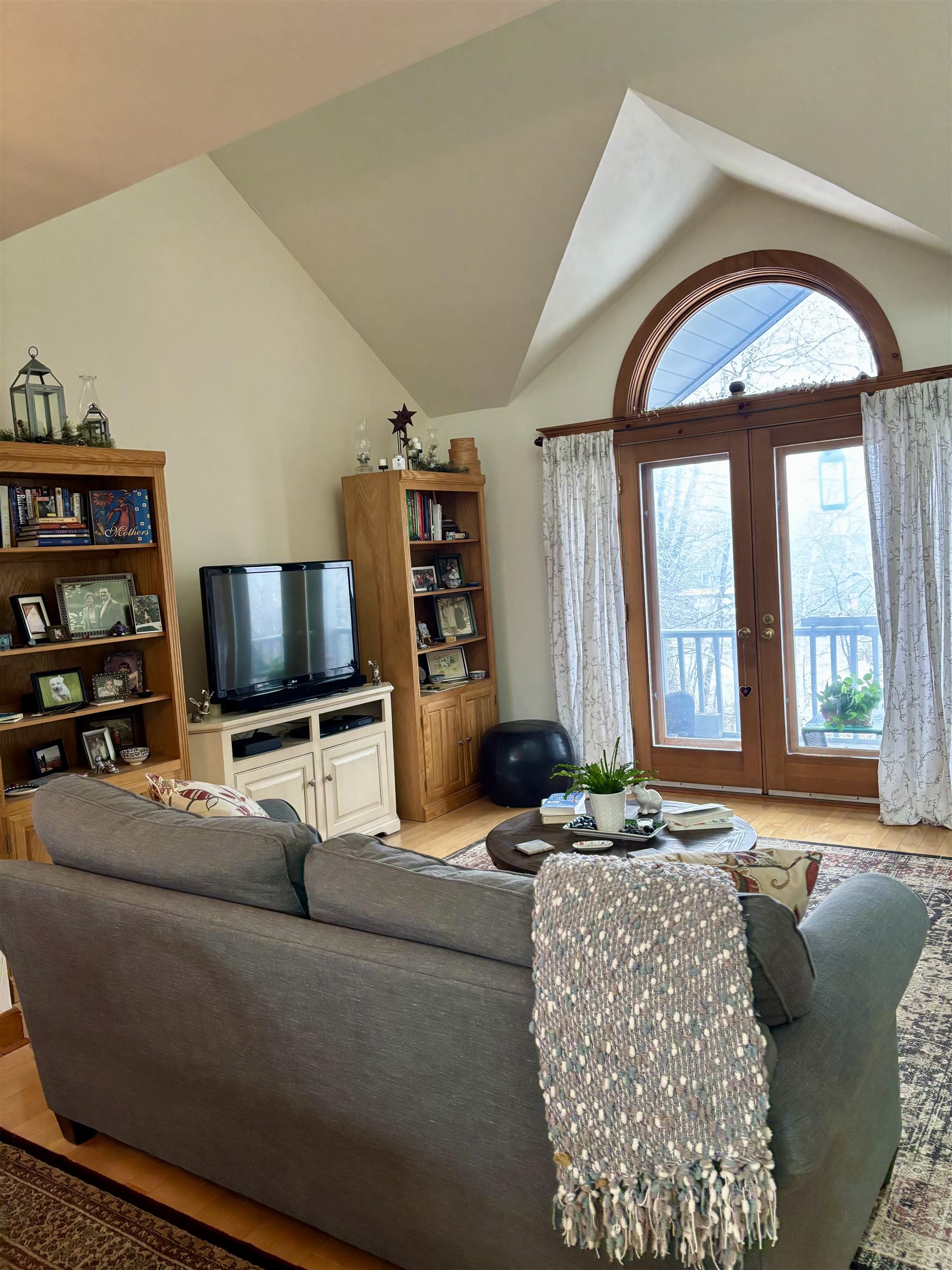 Living room opens to porch overlooking stream & garden 22924103
