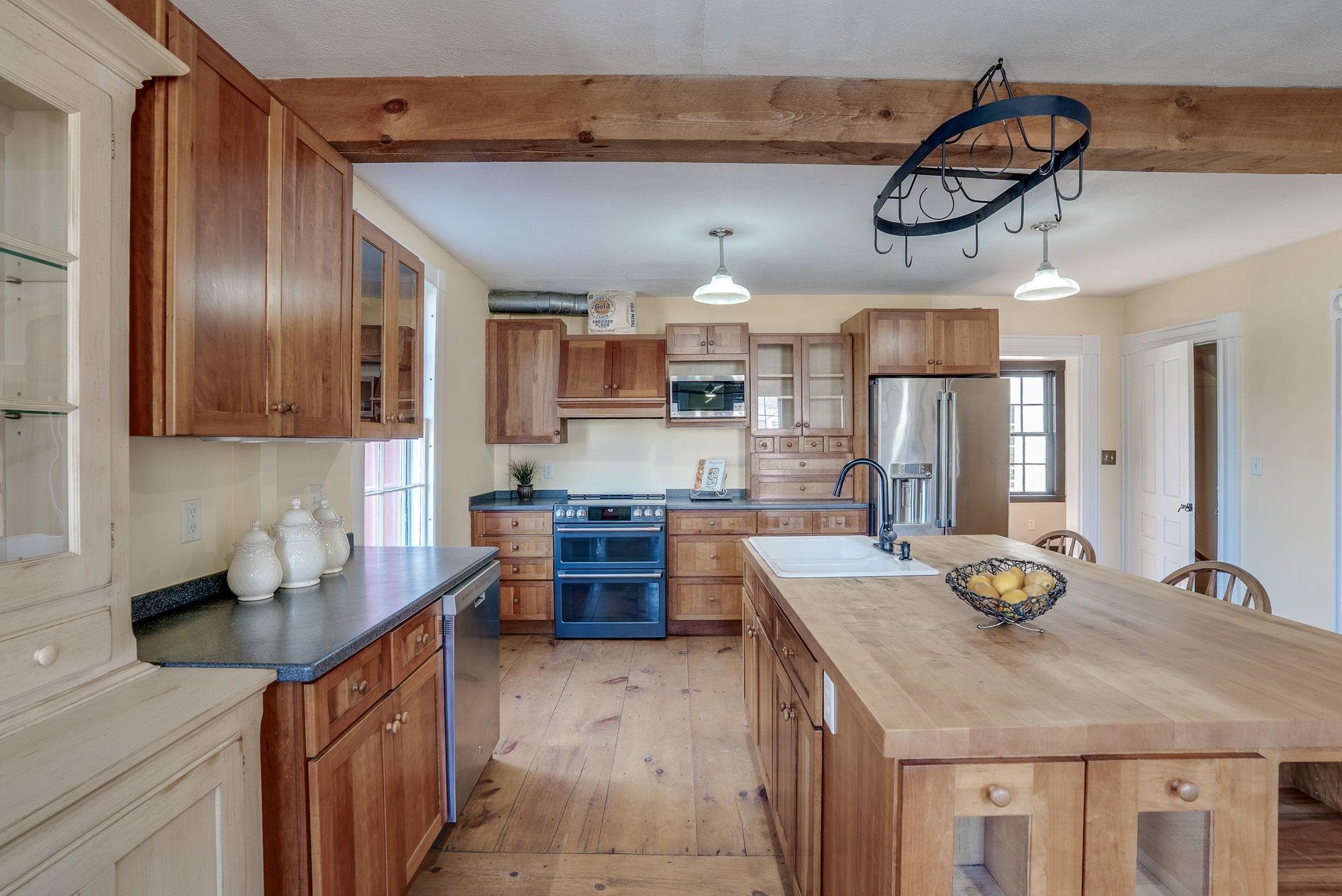 Center Island Kitchen with Beamed Ceiling