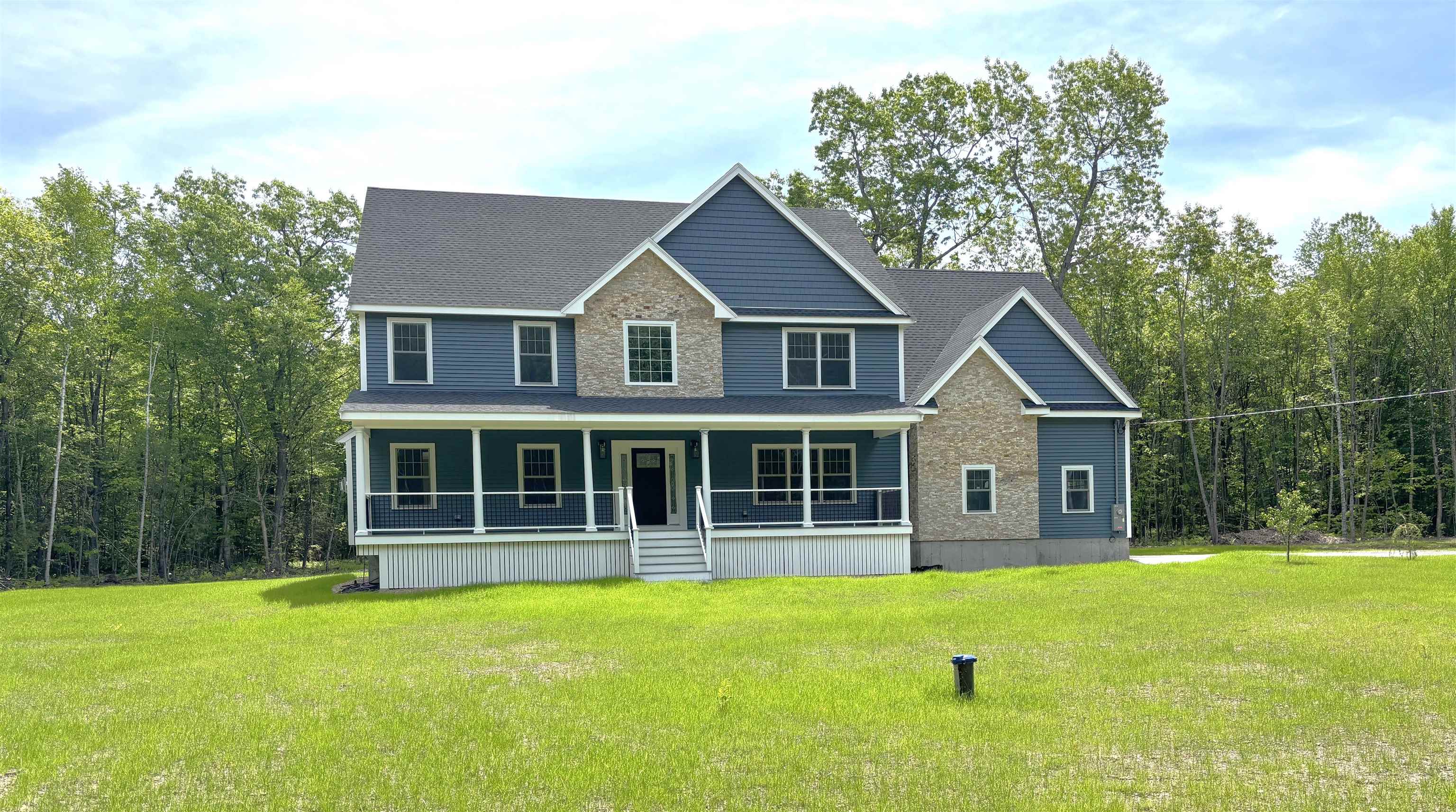 Looking for privacy and plenty of space and in a convenient location? Come see this impressive and newly constructed home. Completed and ready to close! This beautifully  appointed home situated on 4.04 private acres is more than 3600 sq ft, has  a 3-car heated garage and an expansive front facing covered porch. Upon entering you will immediately see the attention to detail and quality that sets this home apart from others. The kitchen is masterfully designed with what seems like an endless amount of cabinets and counter space;  features a 6ft island that easily seats 6, a wet bar and additional cabinets in the eating area that balance perfectly with the layout. The kitchen includes all GE Cafe Series appliances.  The open floor plan brings the kitchen, dining and family rooms together effortlessly. The living spaces are further complemented by 9 ft. ceilings, beautiful white oak floors and natural light in each room. The second floor offers 4 large bedrooms with hardwood floors,  The primary bedroom ensuite has a walk in closet,  a custom tile shower and double sinks. The closet space is abundant in the additional bedroom,  the laundry room is practical and convenient. The second floor bonus room is great flex space for just about any need, either now or future. This home and the yard, (once spring actually arrives) will be an amazing retreat with comfortable living, privacy and space - both indoors and out!