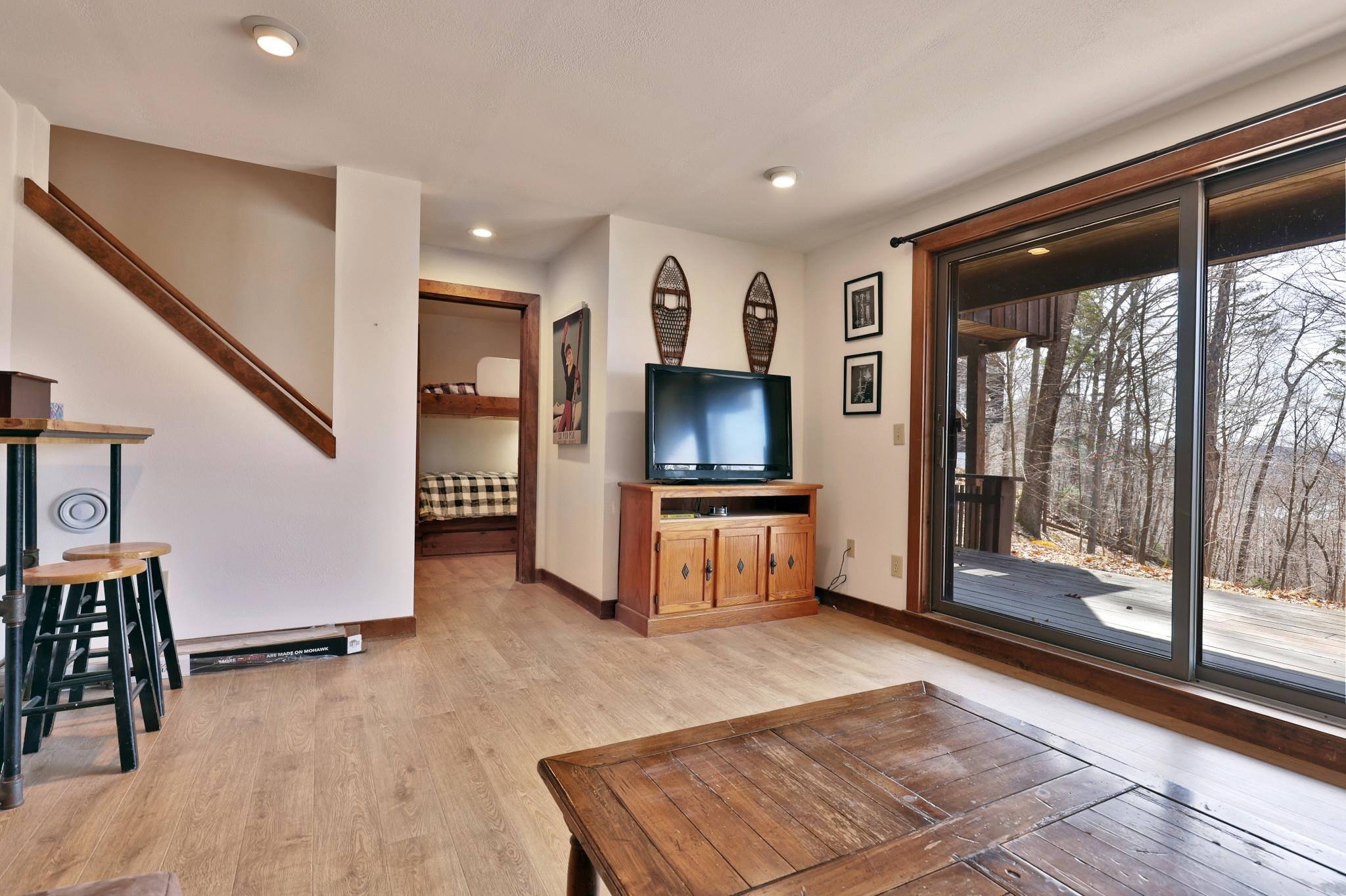 Family room has sliders to deck