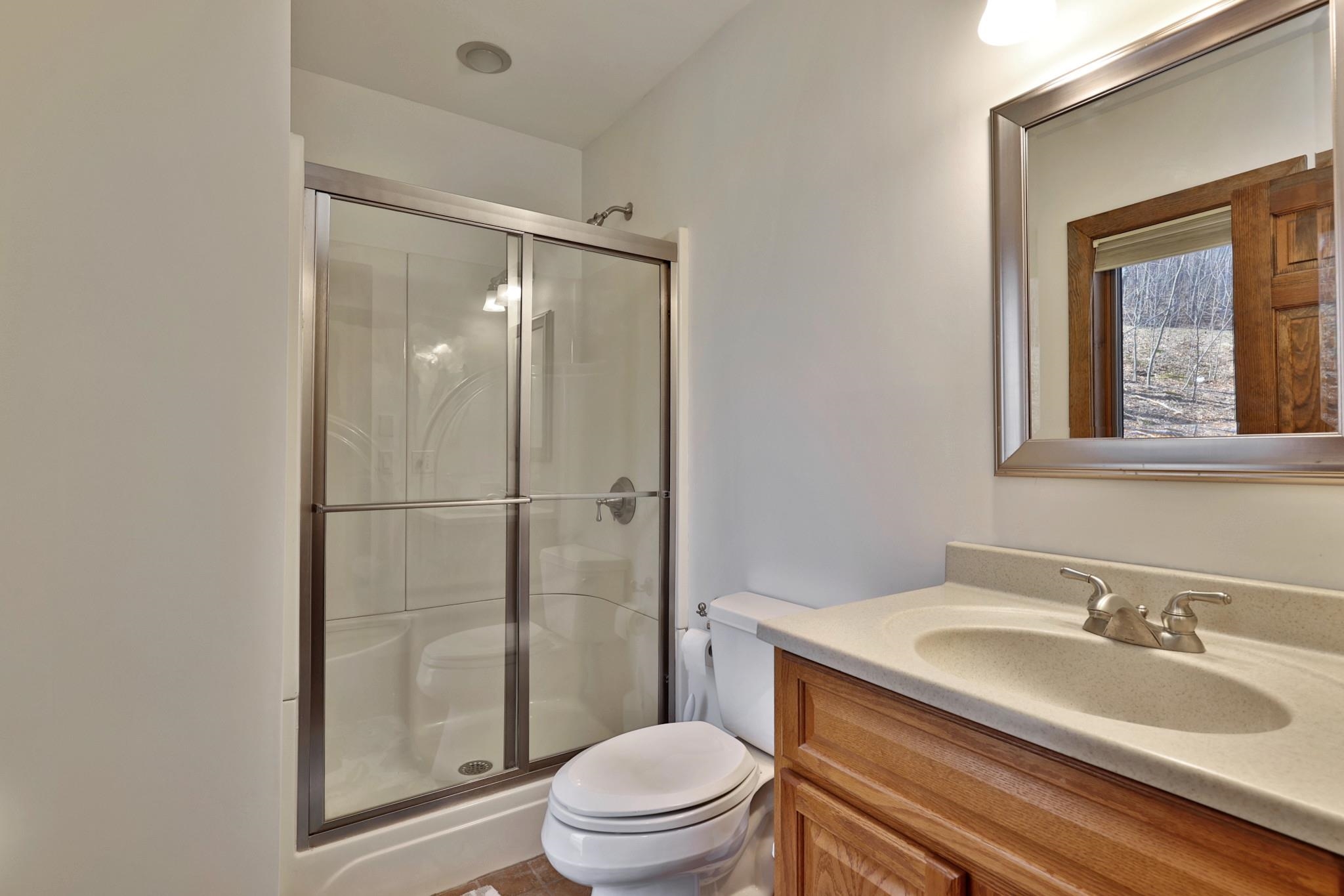 Bath with shower off hallway