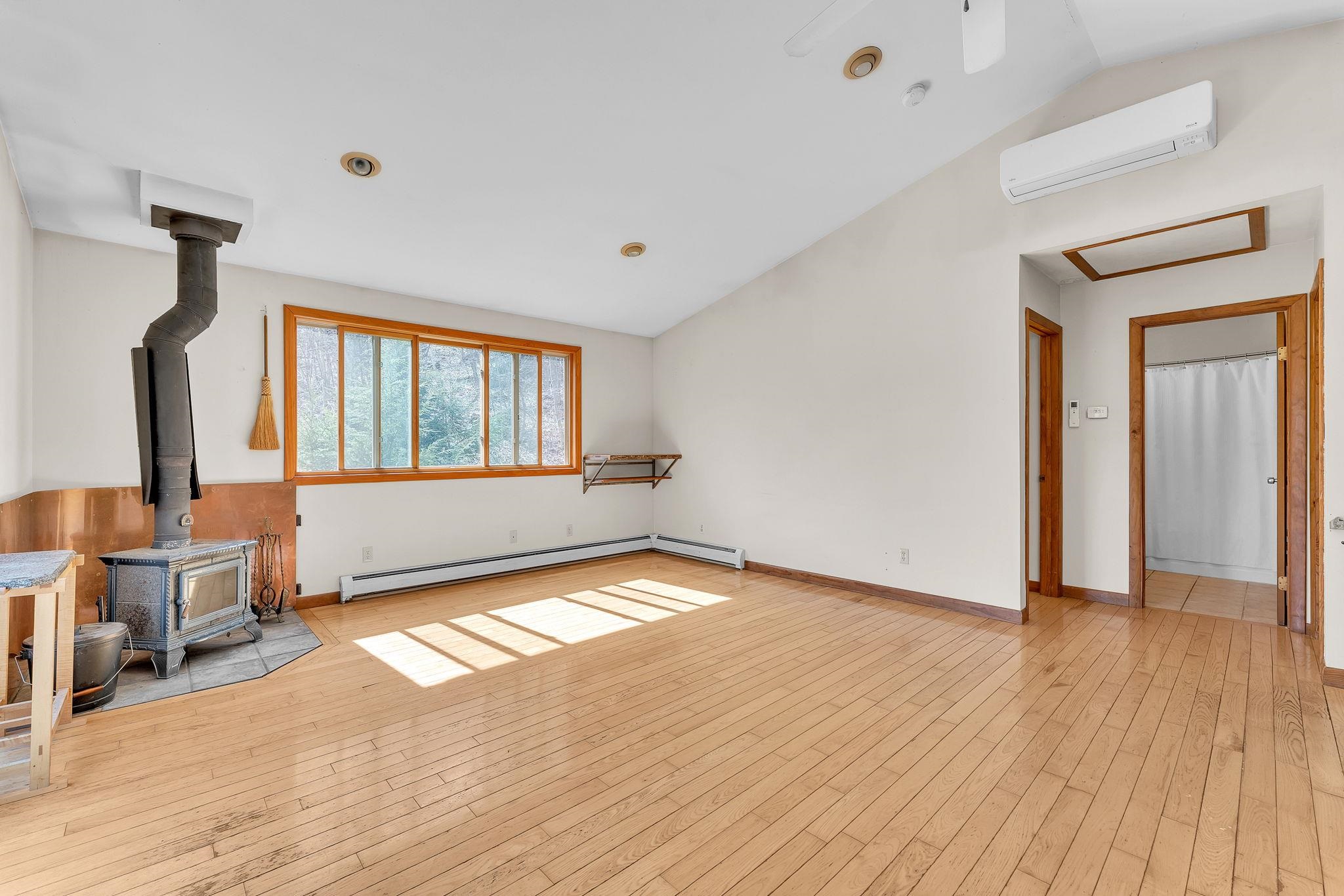 Living area with entry to bedrooms and bathroom