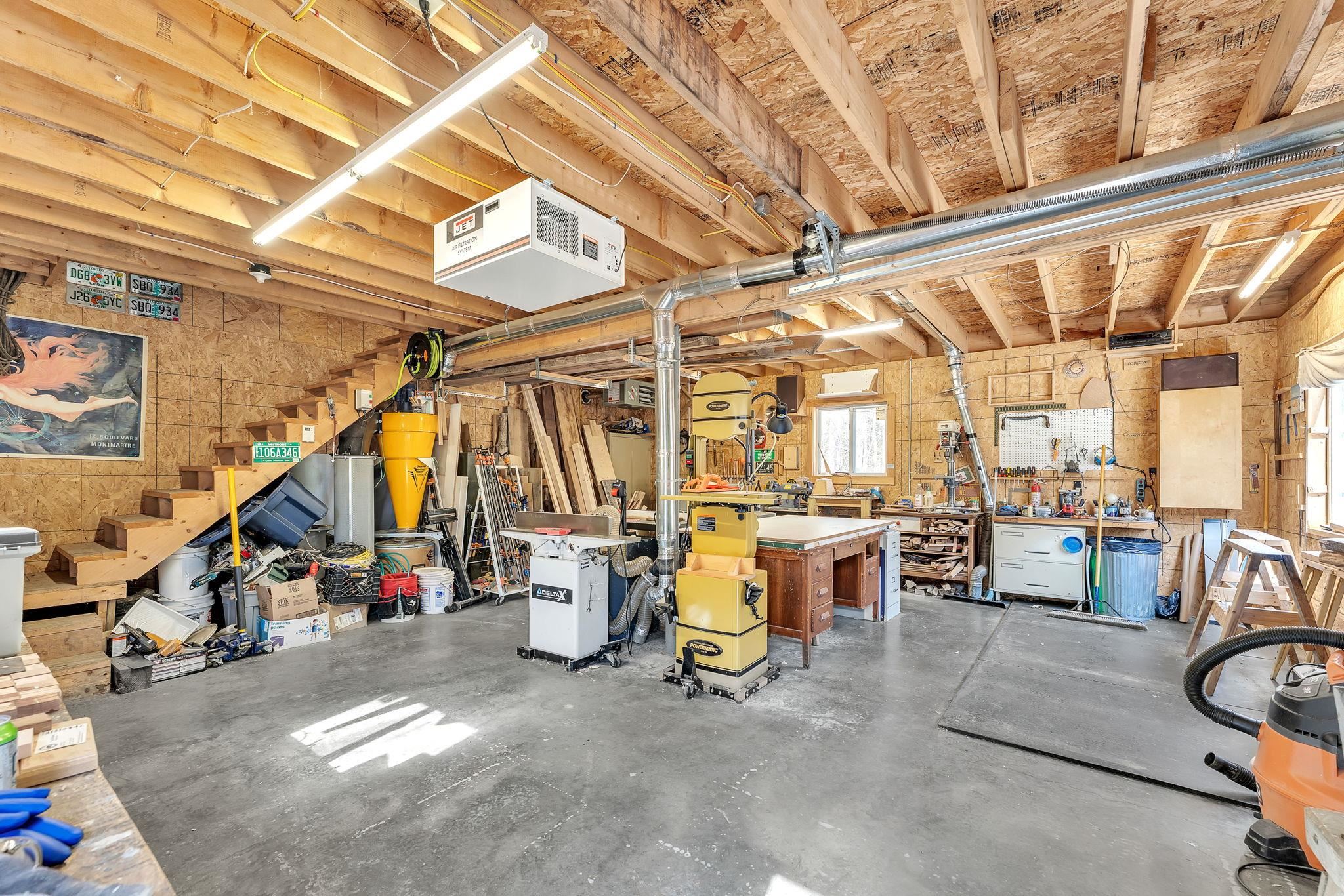 Garage currently used as wood shop but easily converted back to parking