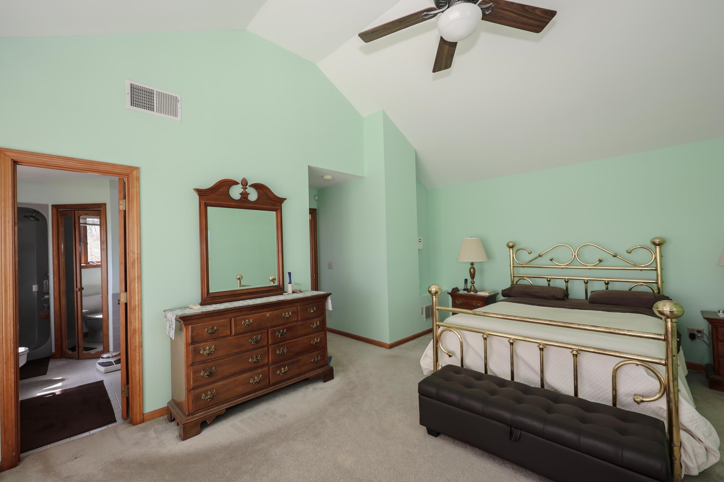 Vaulted ceiling in primary bedroom