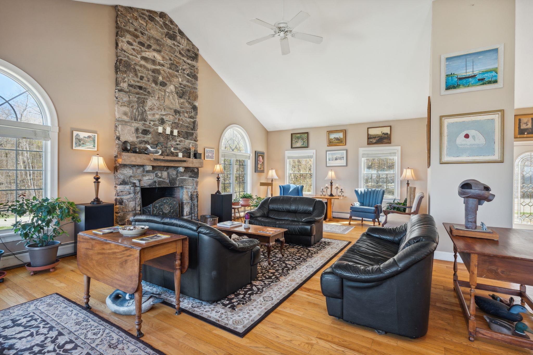 Living area by the granite fireplace 23137196