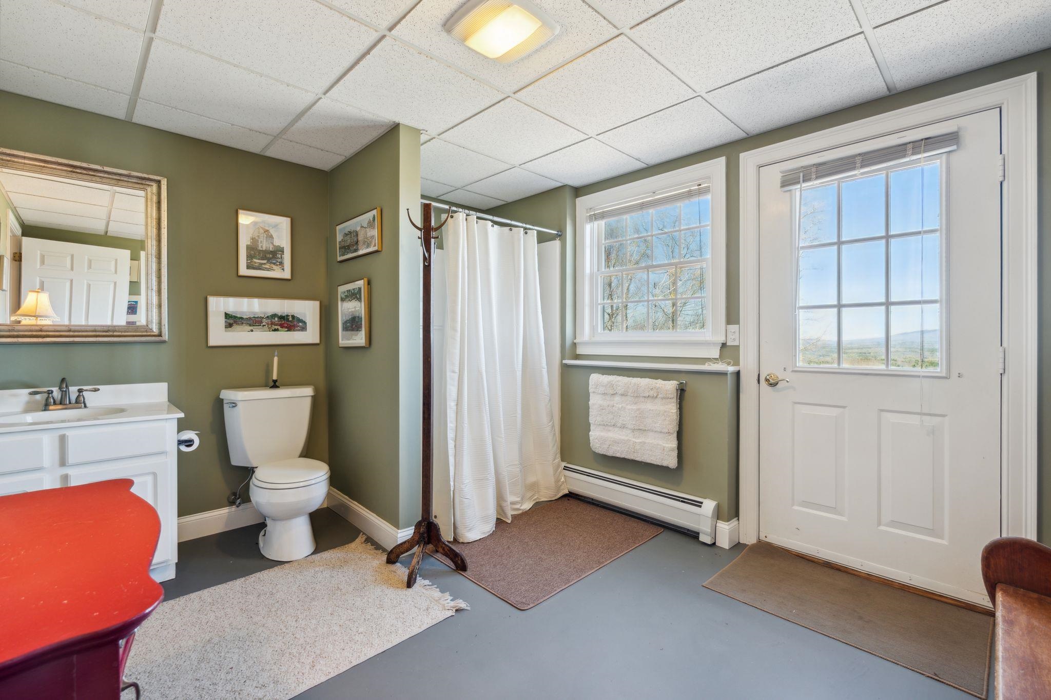 Ground floor bath with door to pool patio 23137038