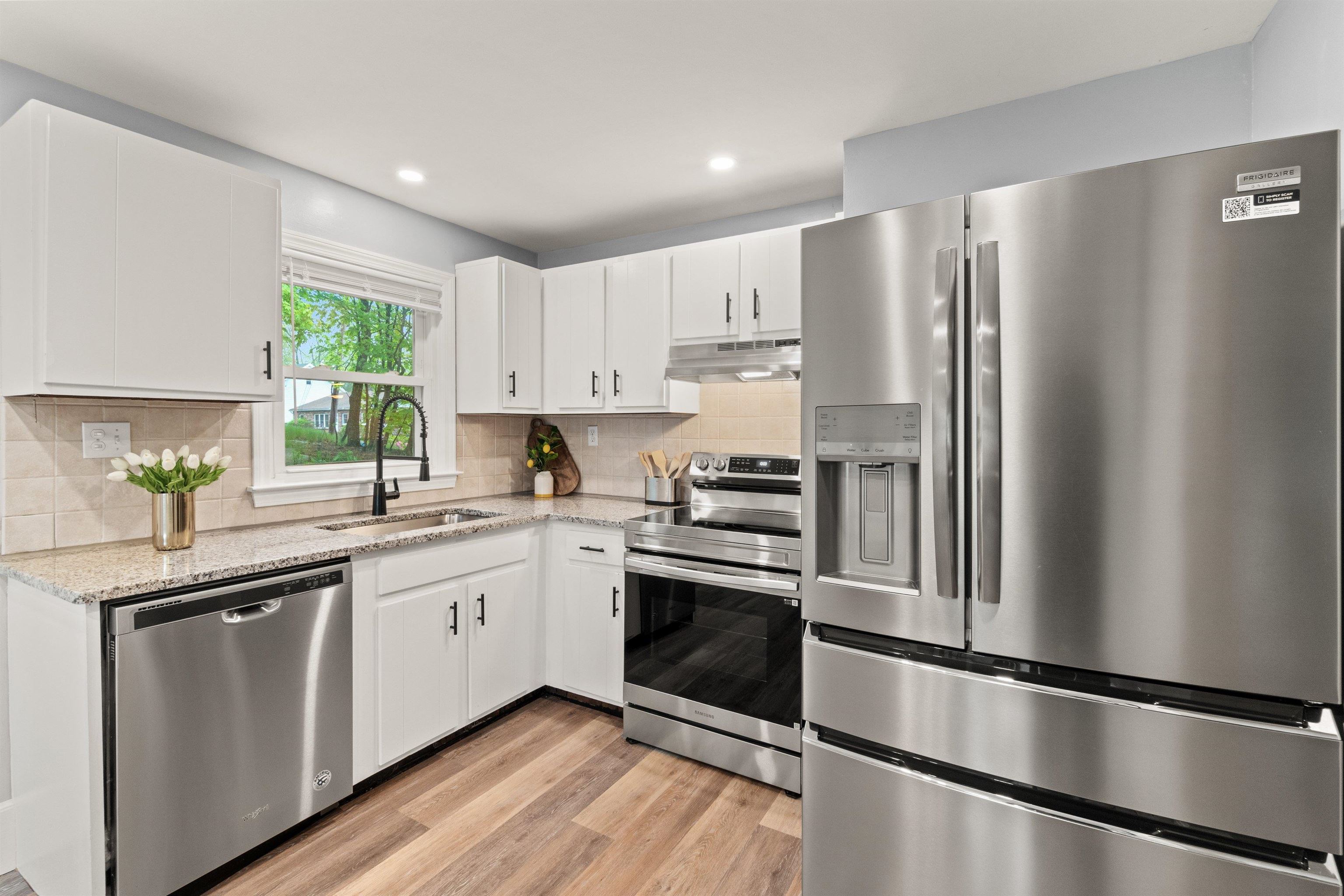 Such an adorable bright & cheery space with luxury vinyl plank flooring. 23152215