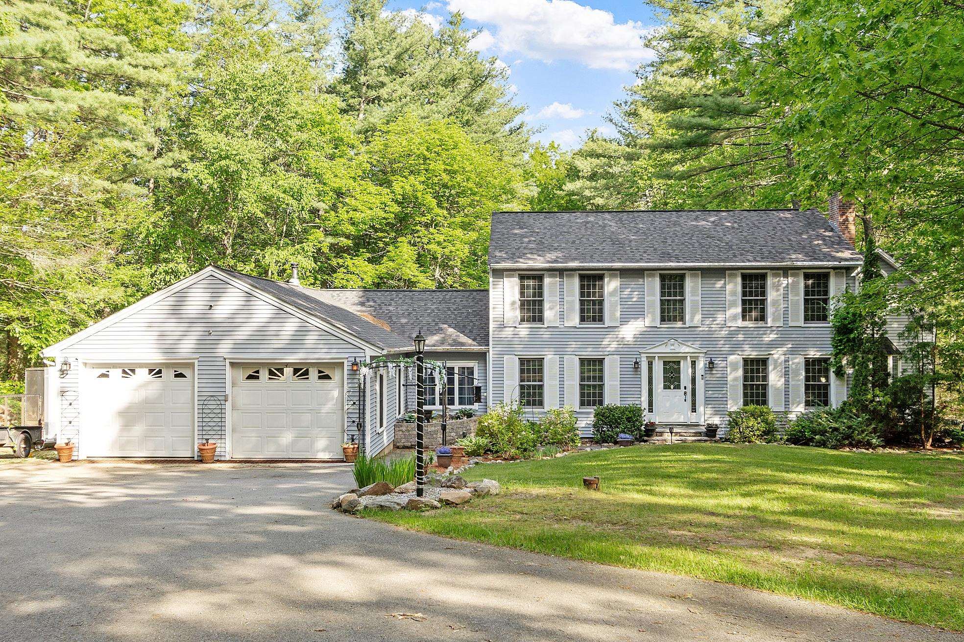 This home is built for memories! It all starts in the custom kitchen with granite counters, island centerpiece, and Thermador range. Large gatherings of family and friends will love the rec room with the custom bar, ample seating, and wood stove. Sliders open up to the expansive deck with plenty of space to lounge and enjoy the wood-edged yard and firepit. Never want for storage with large built-in closets in the living room. Enjoy cozy conversation around the fireplace with the wood stove insert. Two extra rooms allow for separate offices. Upstairs, you'll find a peaceful retreat in the primary bedroom suite with a 3/4 bath and generous walk-in closet with vaulted ceilings. Three other bedrooms and a guest bath complete the upstairs space. This home is generator ready, has a bonus garage great for your ATV or lawnmower, two sheds, newer roof and boiler - while located in a desirable neighborhood on a dead-end street with hiking trails! Time to start making your memories here...
