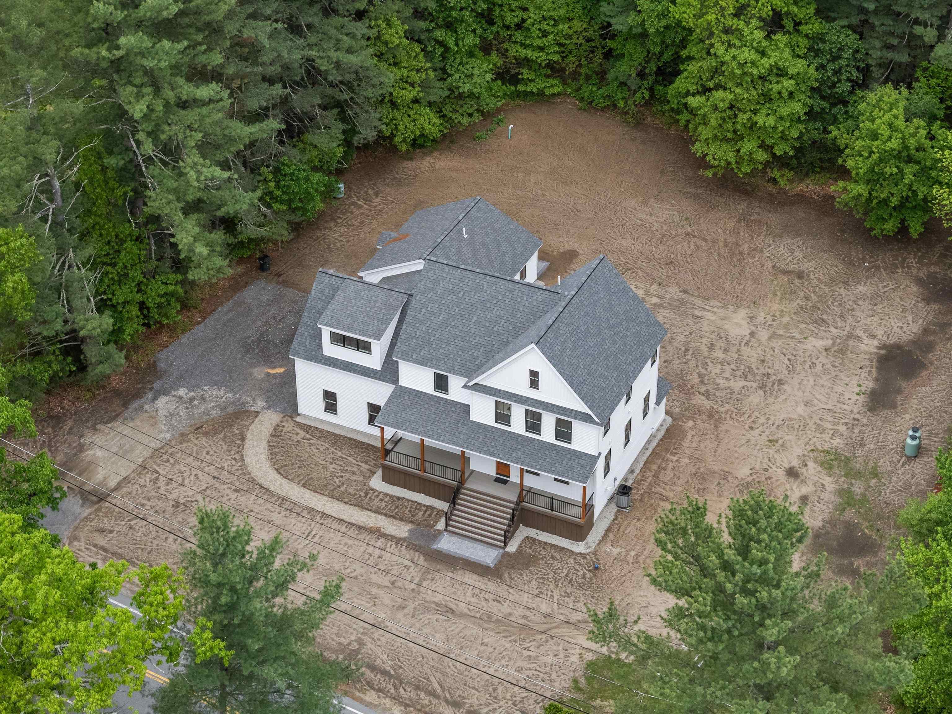 Take a look at this custom 3 bedroom colonial with attached ADU!! Welcome to your dream home in Pelham, NH! This sunny, flat lot boasts a gorgeous custom home with all the amenities you could ever need, complete with a kitchen any chef would dream of! The main house features 3 bedrooms, 2.5 baths, a bonus room, mudroom, office/den and 2 car oversized garage. The primary bedroom has 2 walk in closets, an attached bathroom with soaking tub and tiled shower. Best of all are the features in the main living space: coffered ceilings, gleaming hardwood floors, and Bosch Steel Appliances. Quartz countertops finish off the kitchen and all bathrooms. There is a 2nd floor spacious laundry room, and plenty of storage or extra space in the walk-up/out basement. The attached ADU has it's own garage and 1 bedroom. Laundry hook-ups are also included in the ADU. The spacious backyard is perfect for entertaining or just enjoying some quiet time outdoors. Don't miss out on this one-of-a-kind property in Pelham. Centrally located, but tucked away on your own private 1 acre lot. Pelham is easily accessible to Route 93 & Route 3, and only 45 minutes to Boston, and 40 minutes to the Seacoast. Buyers must be pre-approved.