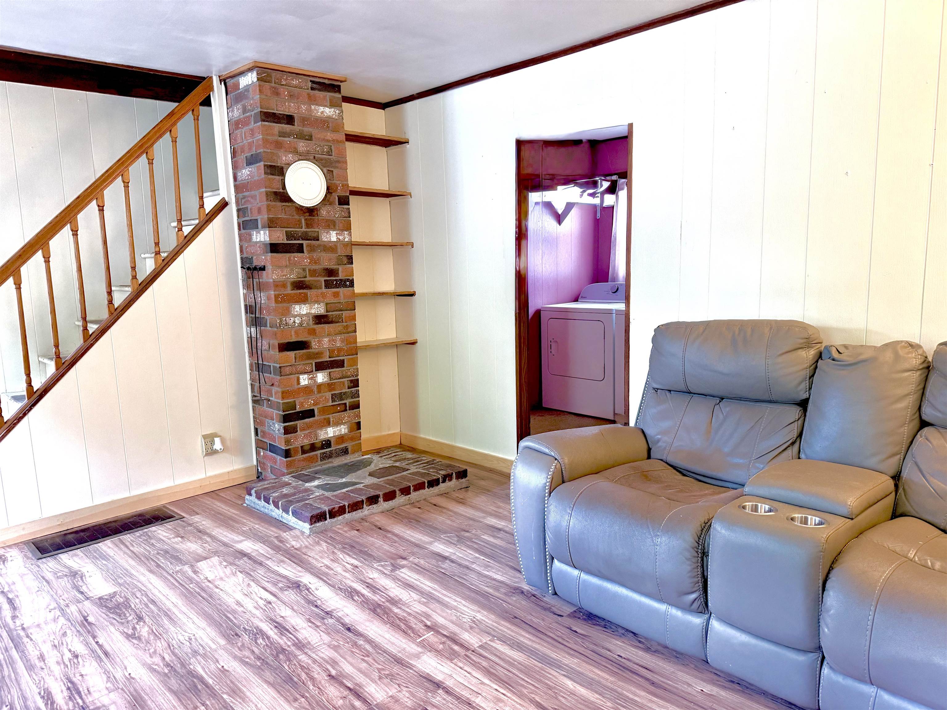 Living room with stairs.