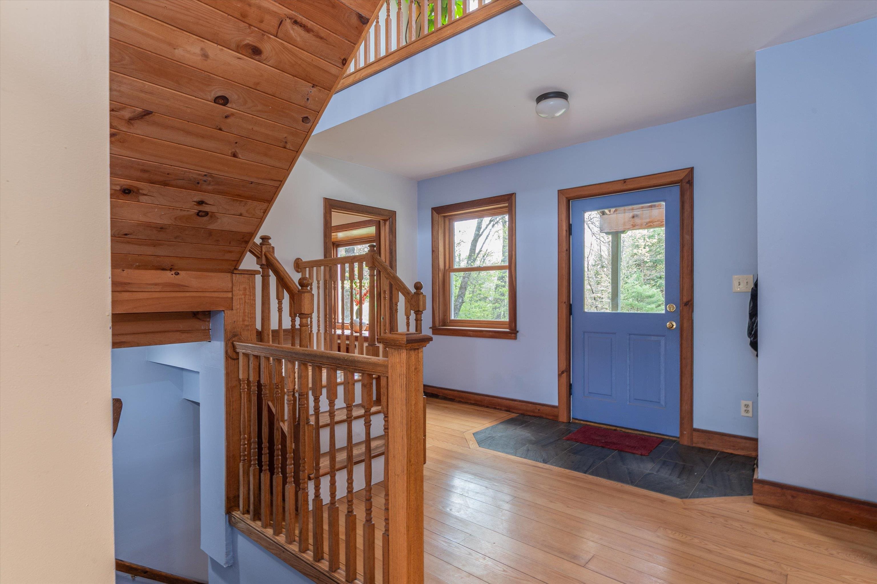 Foyer stairs lead to basement and 2nd floor
