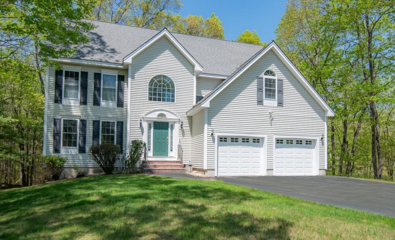 Welcome to this Beautifully Maintained 4 Bedroom Colonial nestled in one of Pelham's most Sought-After Neighborhoods, Mulberry Estates, just minutes from highways, schools, shopping, restaurants, and the vibrant new Tuscan Village! Abutting Conservation Land, this home offers a Peaceful, Private Setting on 2.59 Acres with frequent visits from local wildlife. Inside, enjoy Gleaming Hardwood Floors and a Spacious Granite Kitchen with a Large Island and seating that flows seamlessly into the inviting Family Room featuring a cozy Gas Fireplace. The Open-Concept Dining and Living Rooms create the perfect space for gatherings. The Luxurious Primary Suite features a Cathedral Ceiling, Dual Walk-In Closets, an Oversized Walk-In Tiled Shower, Double Vanity, and Jacuzzi Tub. Three additional Generously Sized Bedrooms, 2nd Floor Laundry with sink, and a 2-Car Attached Garage add convenience and comfort. The Walk-Out Lower Level with windows offers the opportunity to be finished for more space. New Bosch Furnace/AC. Relax on the back deck overlooking your Private Wooded Backyard, perfect for enjoying the sounds of nature and morning birdwatching. Come see all this wonderful home has to offer!