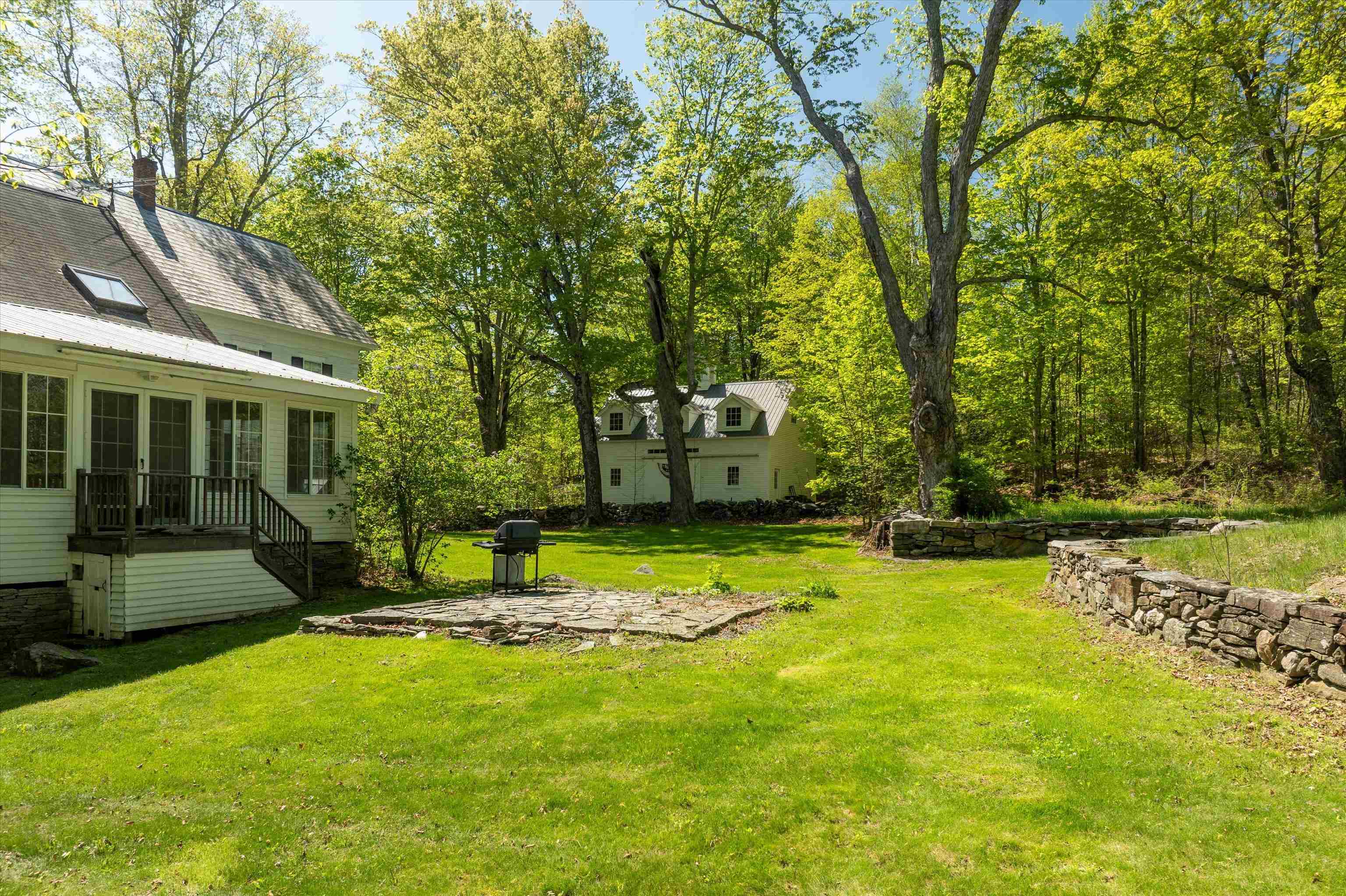 Private backyard with lovely stone walls 23198405