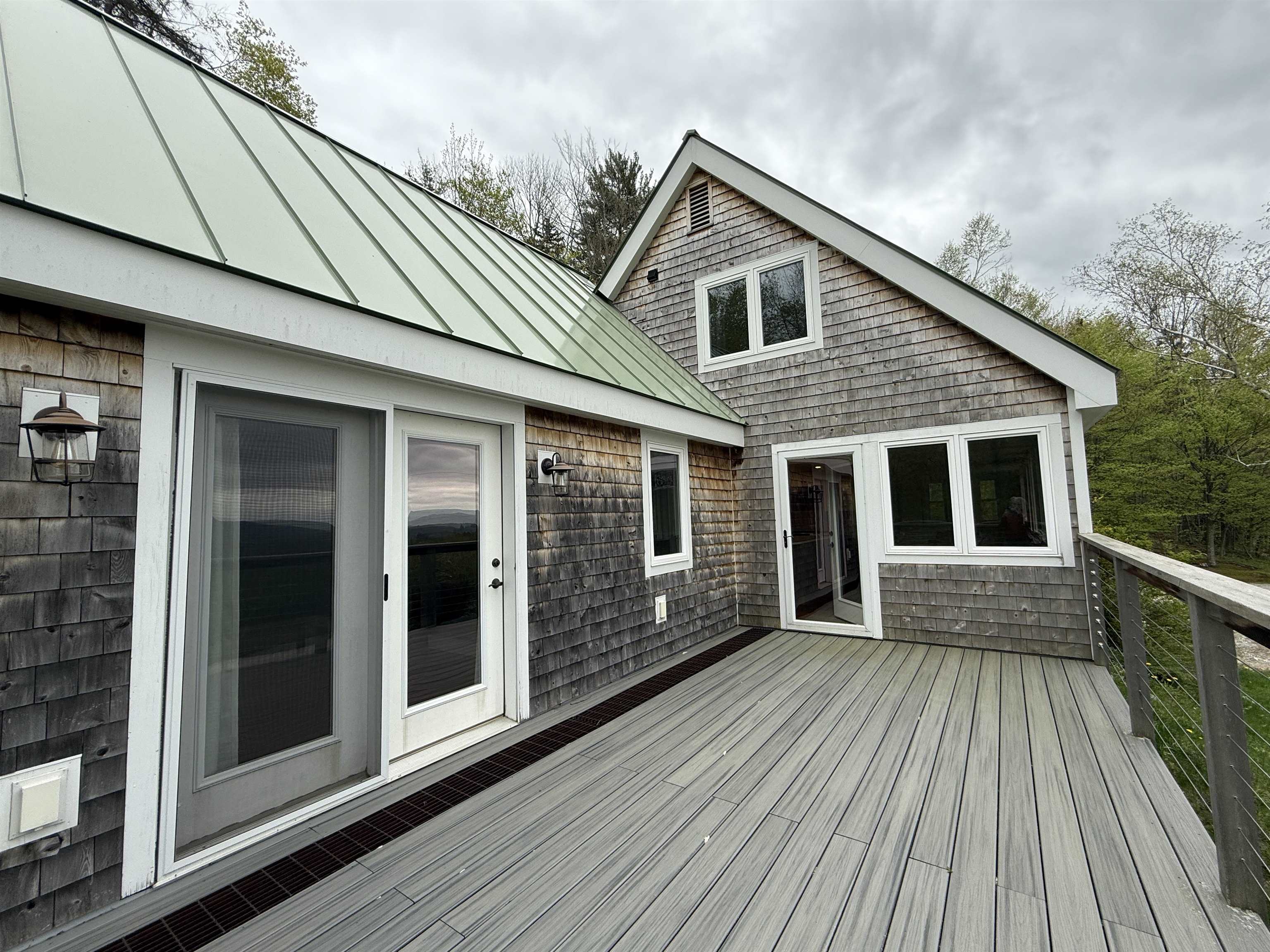 Large deck accessed from primary bedroom and dining 23219010