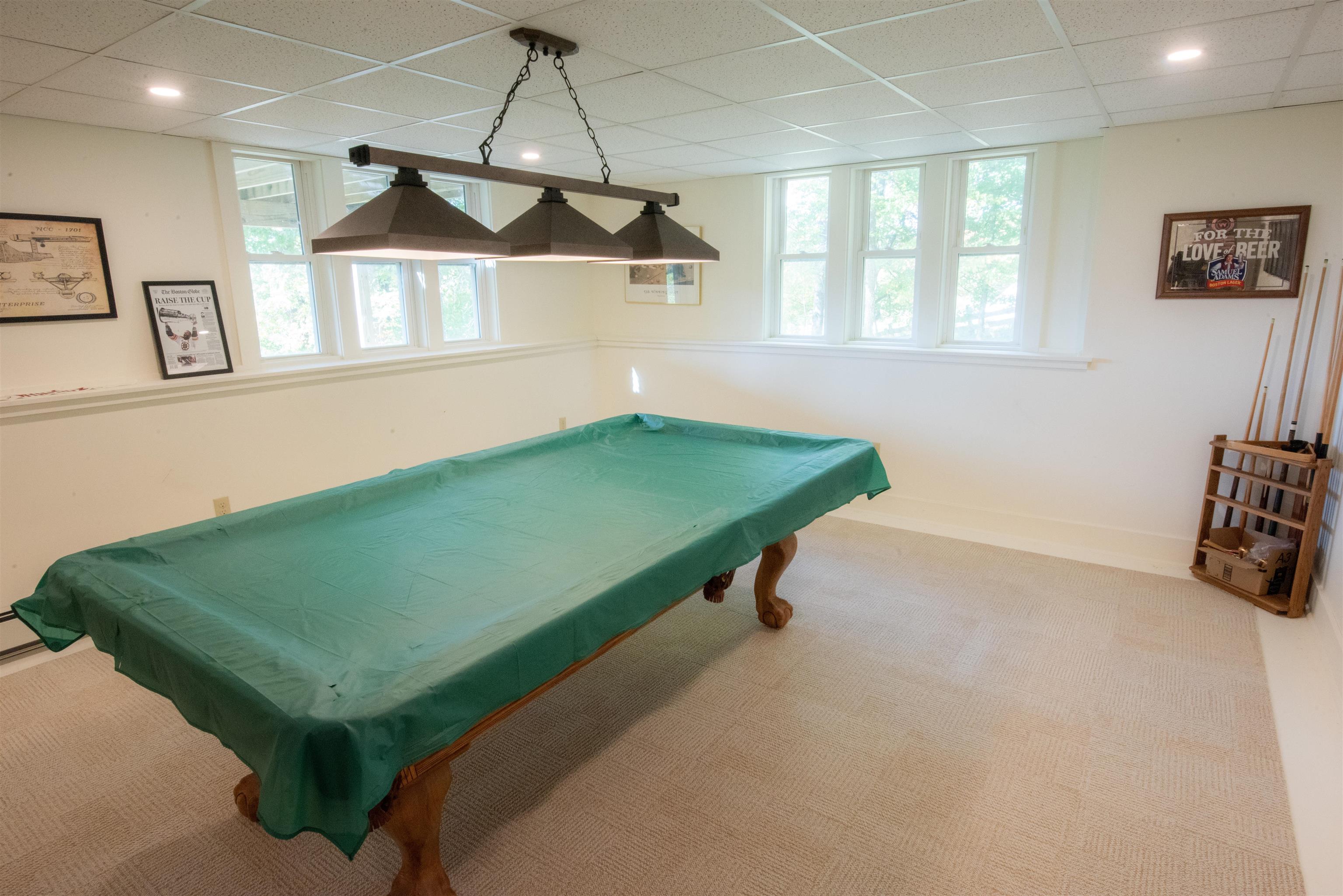 Lower level recreation room complete with pool table 23218447