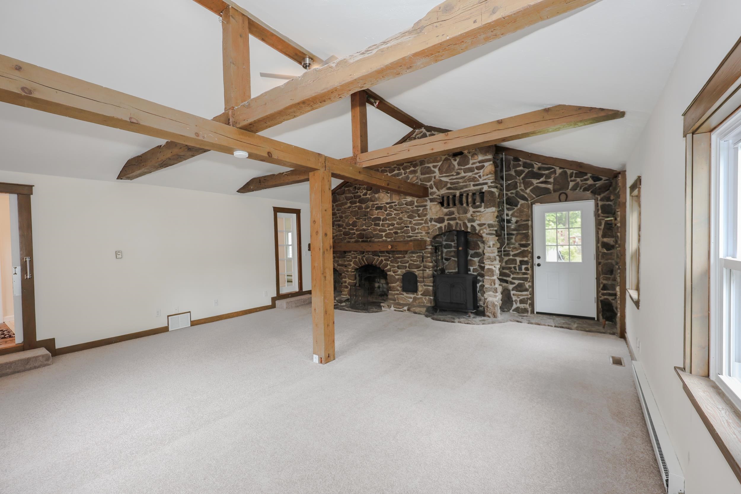 cathedral ceiling with beams in the great room 23222935
