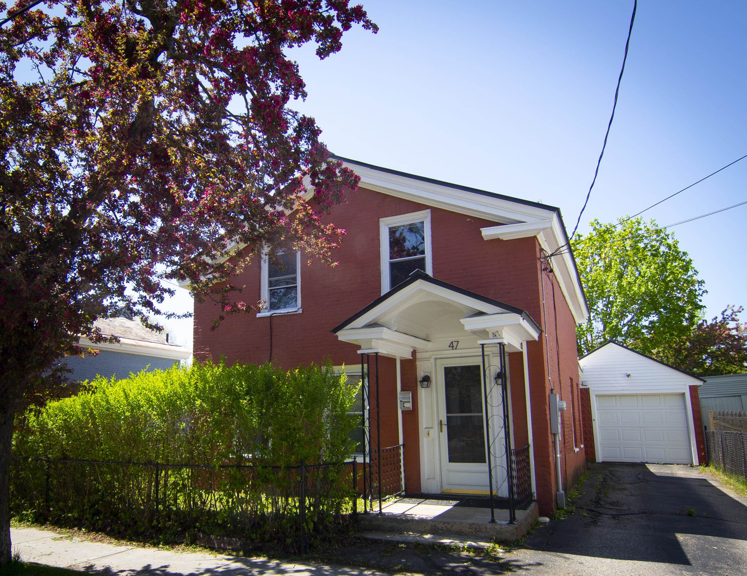 This beautifully updated 4-bedroom, 2-bath brick home is nestled in one of the most sought-after areas of Burlington, offering the perfect blend of style, comfort, and unbeatable convenience. Thoughtfully renovated, the home features elegant stone countertops, brand-new luxury vinyl plank flooring, refreshed bathrooms with modern finishes, and stylish new lighting throughout. The spacious and bright eat-in kitchen is the heart of the home—ideal for hosting, gathering, or enjoying quiet mornings. Outside, the home boasts a charming, well-kept yard that offers space for gardening, play, or relaxing evenings under the stars. Whether you're walking to your favorite restaurants, biking along the nearby path, or enjoying the vibrant energy of the waterfront just steps away, this location truly has it all. Perfect for families, professionals, or anyone looking to enjoy a walkable, connected lifestyle, this home offers timeless curb appeal and modern updates in one of the city’s most vibrant communities. Don’t miss this rare opportunity to own a turnkey property in a location that simply can’t be beat. Some photos digitally staged.