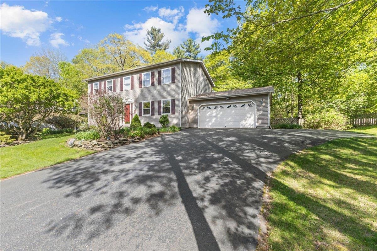 This highly sought after 3 bed, 2 1/2 bath Countryside colonial is situated on a large lot with a beautifully landscaped backyard. The first floor of the home features a kitchen, a den, dining room and living room with wood burning fireplace. The large kitchen features an island, stainless steel appliances and lots of storage and prep area. The kitchen opens to the dining room featuring hardwood floors. Just off the dining room you will find the home's private and cozy den. As you continue through the first floor you find the very spacious living room with hardwood floors. There is also a door leading to the home's private screened porch. There is a half bath on the first floor as well as a an area leading to the home's attached two car garage. The second floor features the en-suite primary bedroom with renovated full bath and walk-in closet. The second floor has two additional guest bedrooms all  as well as a full guest bath. The lower level is partially finished providing additional living space as well as ample storage and work areas. The backyard is the true gem of this home. The home's large covered porch and gazebo overlooks the immaculately curated garden backyard featuring an outbuilding and mature landscaping throughout. In addition to the home's wonderful outdoor space, the Countryside neighborhood also has a community pool, tennis and bike path access. Countryside is located close to local schools, shops and restaurants and more. A must see.