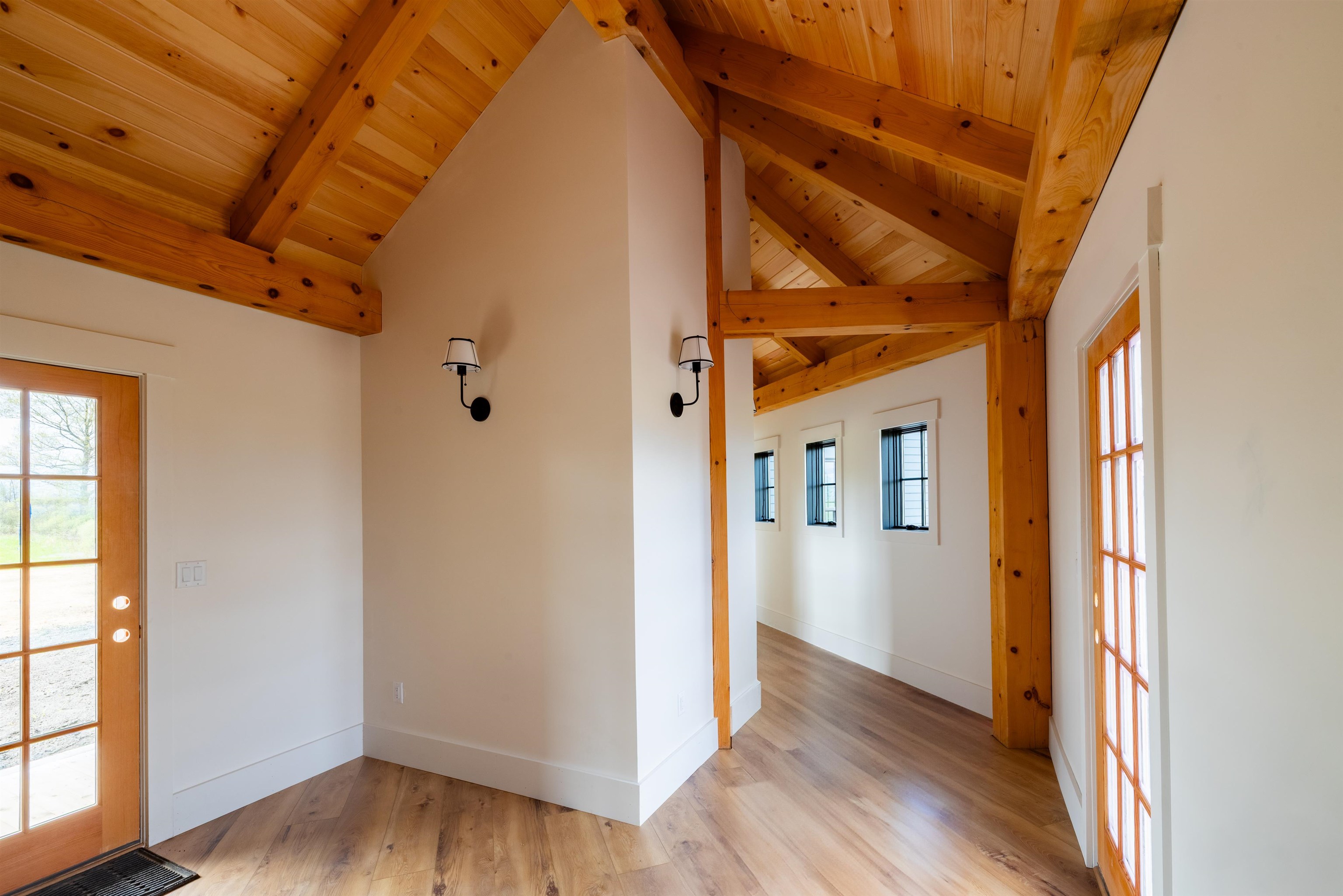 Mudroom to hallway to great room & kitchen