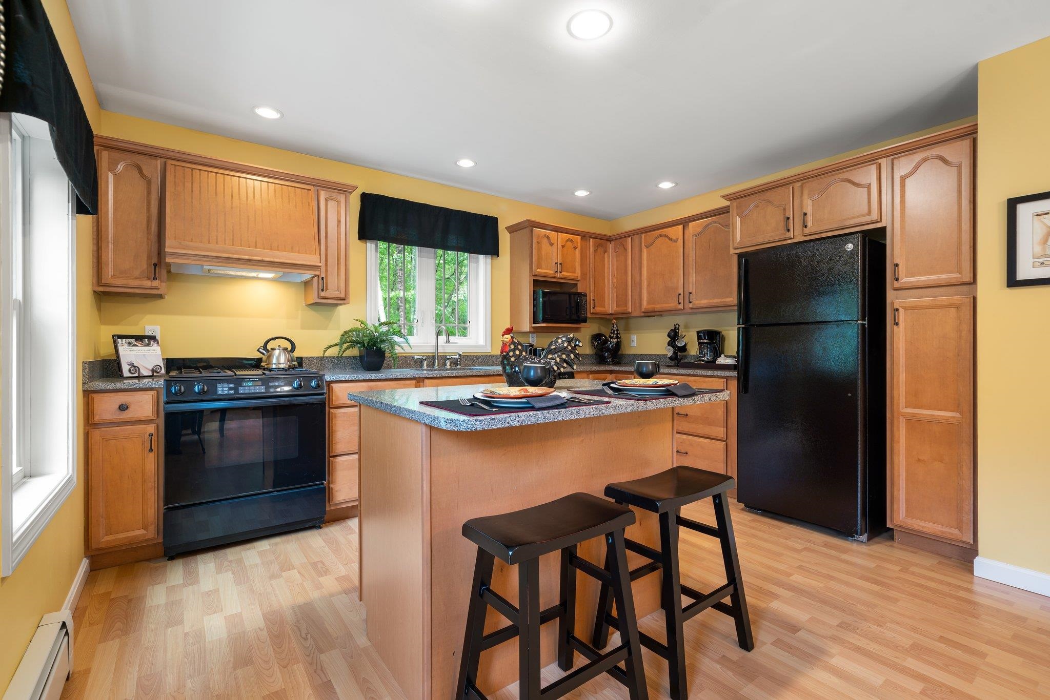 Maple Cabinets & Wood-Look Manufactured Flooring