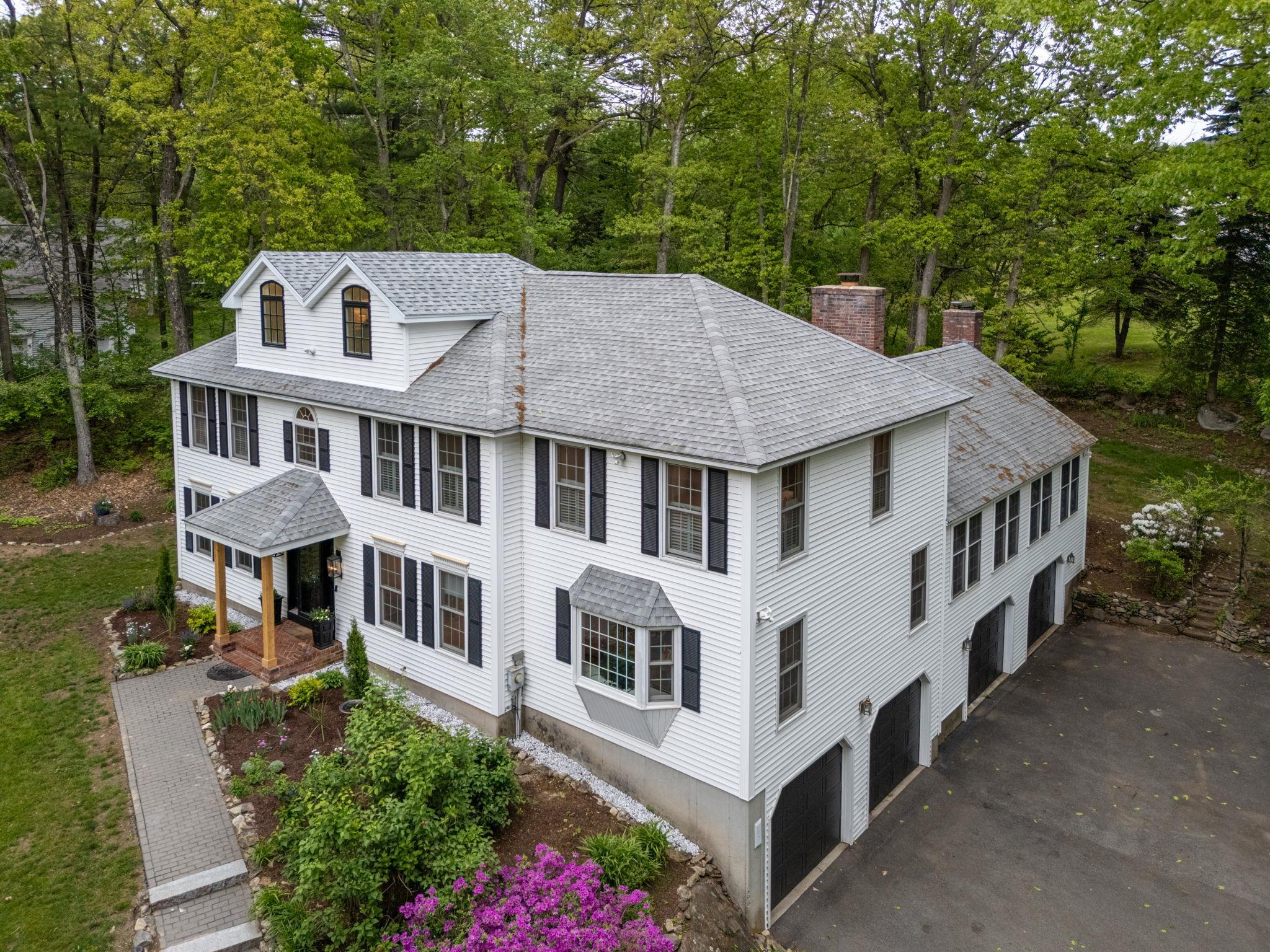 Discover timeless elegance in this custom-built 5BR, 3.5BA Colonial estate, nestled on a private, professionally landscaped 1.16-acre cul-de-sac lot in one of Londonderry’s most prestigious neighborhoods. Designed for both grand entertaining and everyday comfort, this custom-built home offers exceptional living spaces filled with warmth and sophistication. The stunning chef’s kitchen flows seamlessly into an expansive Great Room with soaring cathedral ceilings, rich rock maple flooring, a wood-burning fireplace, and double doors that lead to a sprawling deck—ideal for hosting gatherings or enjoying quiet evenings surrounded by nature. The main level features formal dining and living rooms, den, a sun-filled home office, laundry, and a half bath. Upstairs, retreat to a serene primary suite with a private bath, along with three additional generously sized bedrooms and two full bathrooms. A finished attic provides a flexible 5th bedroom or a large bonus room. Additional highlights include a 4-bay garage with workshop, New HVAC system, central vacuum, 200 amp service with subpanel, standby generator, full unfinished basement with mudroom and workshop area, and a full irrigation system.  Located in a desirable neighborhood served by Londonderry’s top-rated schools, this exceptional home offers the perfect blend of privacy, prestige, and comfort. Showings start at the Open House on 5/31.