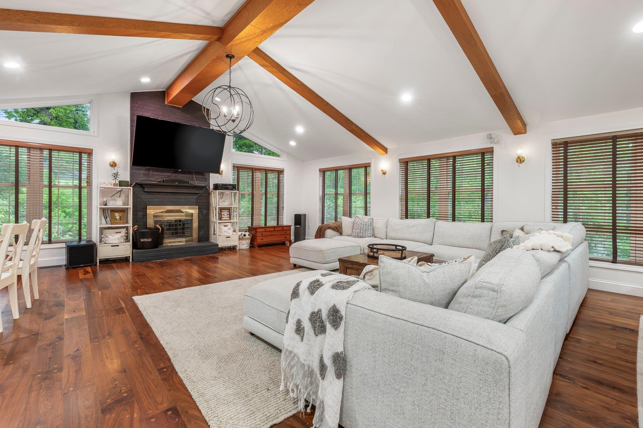 Discover timeless elegance in this custom-built 5BR, 3.5BA Colonial estate, nestled on a private, professionally landscaped 1.16-acre cul-de-sac lot in one of Londonderry’s most prestigious neighborhoods. Designed for both grand entertaining and everyday comfort, this custom-built home offers exceptional living spaces filled with warmth and sophistication. The stunning chef’s kitchen flows seamlessly into an expansive Great Room with soaring cathedral ceilings, rich rock maple flooring, a wood-burning fireplace, and double doors that lead to a sprawling deck—ideal for hosting gatherings or enjoying quiet evenings surrounded by nature. The main level features formal dining and living rooms, den, a sun-filled home office, laundry, and a half bath. Upstairs, retreat to a serene primary suite with a private bath, along with three additional generously sized bedrooms and two full bathrooms. A finished attic provides a flexible 5th bedroom or a large bonus room. Additional highlights include a 4-bay garage with workshop, central vacuum, 200 amp service with subpanel, standby generator, full unfinished basement with mudroom and workshop area, and a full irrigation system.  Located in a desirable neighborhood served by Londonderry’s top-rated schools, this exceptional home offers the perfect blend of privacy, prestige, and comfort. Contact today for a private showing.
