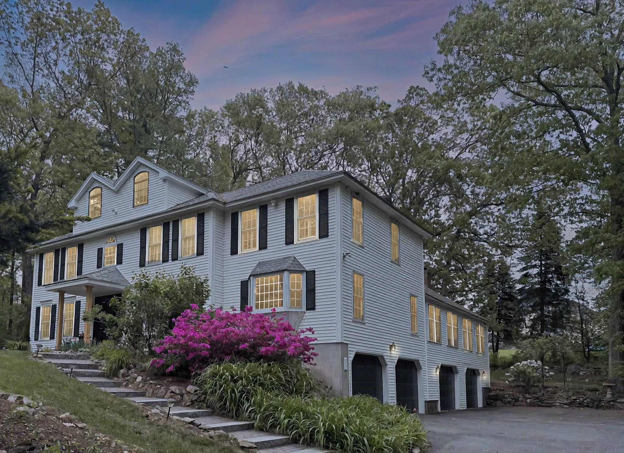 Discover timeless elegance in this custom-built 5/6BR, 3.5BA Colonial estate, nestled on a private, professionally landscaped 1.16-acre cul-de-sac lot in one of Londonderry’s most prestigious neighborhoods. Designed for both grand entertaining and everyday comfort, this custom-built home offers exceptional living spaces filled with warmth and sophistication. The stunning chef’s kitchen flows seamlessly into an expansive Great Room with soaring cathedral ceilings, rich rock maple flooring, a wood-burning fireplace, and double doors that lead to a sprawling deck—ideal for hosting gatherings or enjoying quiet evenings surrounded by nature. The main level features formal dining and living rooms, den, a sun-filled home office, laundry, and a half bath. Upstairs, retreat to a serene primary suite with a private bath, along with three additional generously sized bedrooms and two full bathrooms. A finished attic provides a flexible 5th bedroom or a large bonus room. Additional highlights include a 4-bay garage with workshop, central vacuum, 200 amp service with subpanel, standby generator, full unfinished basement with mudroom and workshop area, and a full irrigation system.  Located in a desirable neighborhood served by Londonderry’s top-rated schools, this exceptional home offers the perfect blend of privacy, prestige, and comfort. Contact today for a private showing.