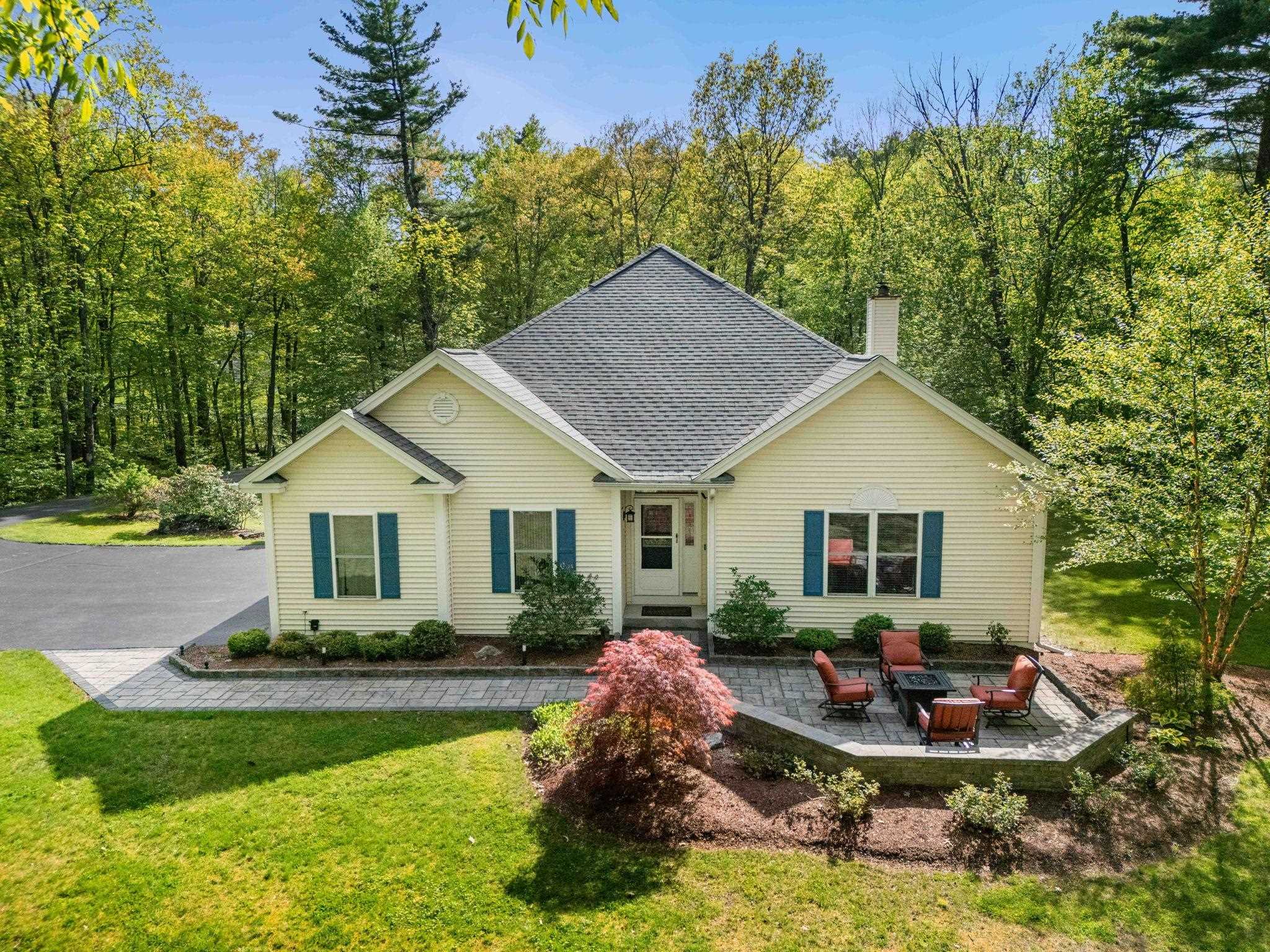 Step inside this stunning & thoughtfully designed ranch style home to discover the breathtaking open concept living space that includes a dream entertaining kitchen w/ massive center granite island, stainless appliances, coffee nook w/ wine fridge, hardwood flooring & oversized skylight, all combined w/ the main living room including cozy wood stove, dining & eat-in area & attached to the bright & beautiful sunroom that overlooks your private backyard. Primary suite w/ walk-in closet, custom tile shower & private door leading out to the deck. Three additional bedrooms w/ spacious closets, full bath, 1/2 bath, separate laundry room & access to garage w/ EV charging outlet is all included on the 1st floor. Walk out basement is tastefully finished w/ a family room including a gas stove, additional room for an office and/or guests, workout area, 3/4 bath & custom home theater room w/ stadium seating where you can enjoy your favorite movies & lots of storage space in the unfinished portion of the basement. Outdoor living is equally impressive w/ the large deck overlooking the serene wooded backyard w/ hot tub, fire pit & your very own private walking trails. Outside you will also find the new front patio w/ built in lighting, separate fenced area for pets that they can access directly off the deck, storage shed & irrigation. Central A/C, New furnace, new roof, new well pump & new carpeting. Close to schools, all shopping and highway for easy commuting! Showings to start 5/31