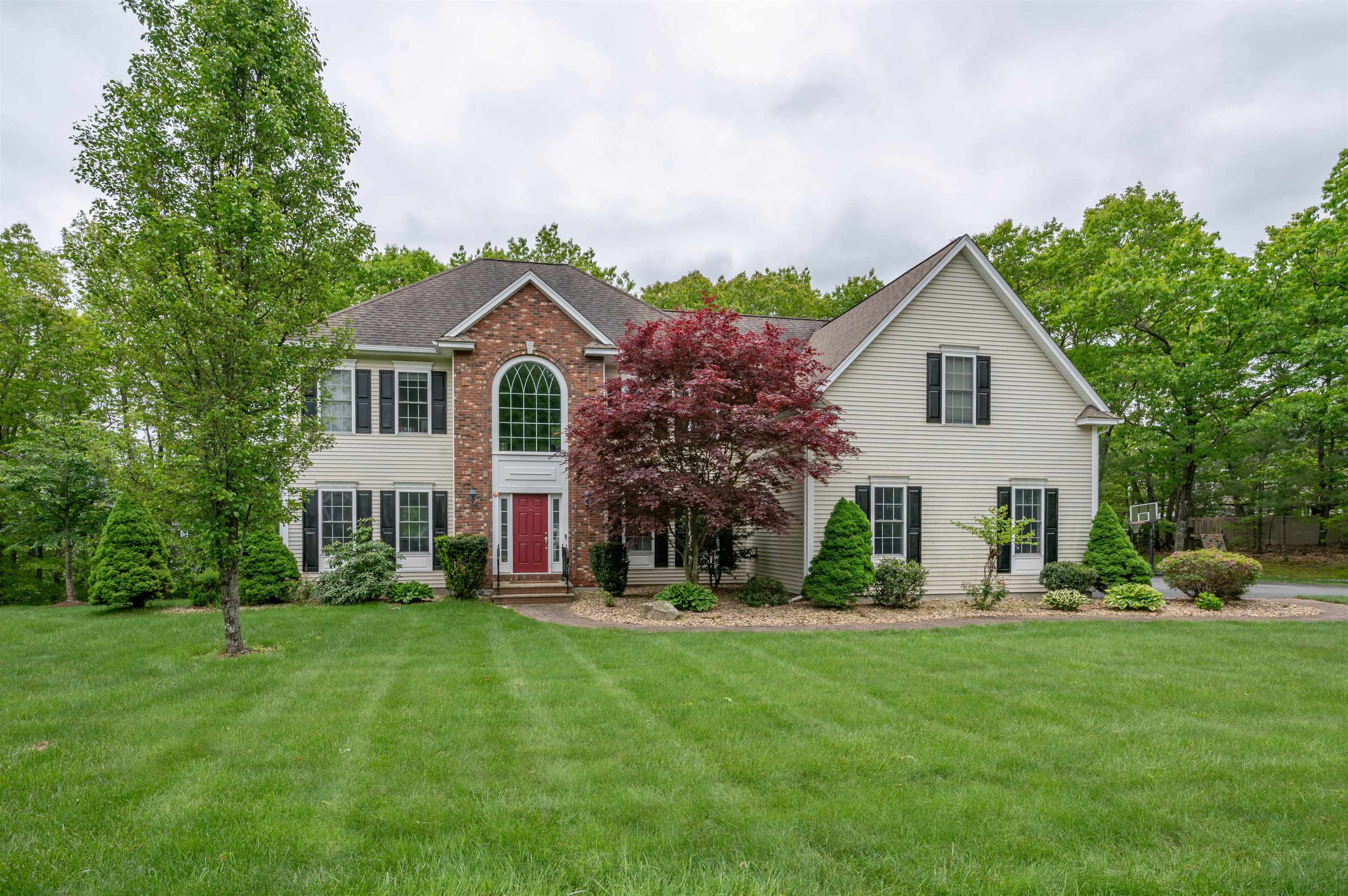 This home is equipped with FULLY PAID OFF solar panels and promotes energy efficiency and reduced utility costs. Nestled in the highly sought-after Spruce Pond Estates neighborhood, this meticulously updated 4-bedroom, 3.5-bathroom Colonial offers a harmonious blend of elegance and functionality. Designed for both comfort and sophisticated living, this residence showcases modern craftsmanship throughout. The heart of the home is the gourmet kitchen, featuring granite countertops, abundant cabinetry that has been freshly painted, and high-end appliances—ideal for culinary enthusiasts. The spacious living room provides a refined setting for relaxation and gatherings. A private office offers a quiet space for work or study. The luxurious master suite serves as a private retreat, complete with a spa-like bathroom and a generously sized walk-in closet. There are also three other bedrooms, full bath, and laundry room on the second floor. The fully finished lower level is designed with versatility in mind, including an add'l room, a new bathroom, and tons of storage, offering potential for an in-law suite or entertainment hub. Entire inside freshly painted. BRAND NEW 12'x28' deck that overlooks a landscaped backyard with irrigation, featuring a newer patio, perfect for outdoor dining and leisure. The three-car garage provides ample storage and parking space. Proximity to shopping, dining, & the highway. Also access from subdivision to the rail trail. OPEN HOUSE FRIDAY from 4-6.