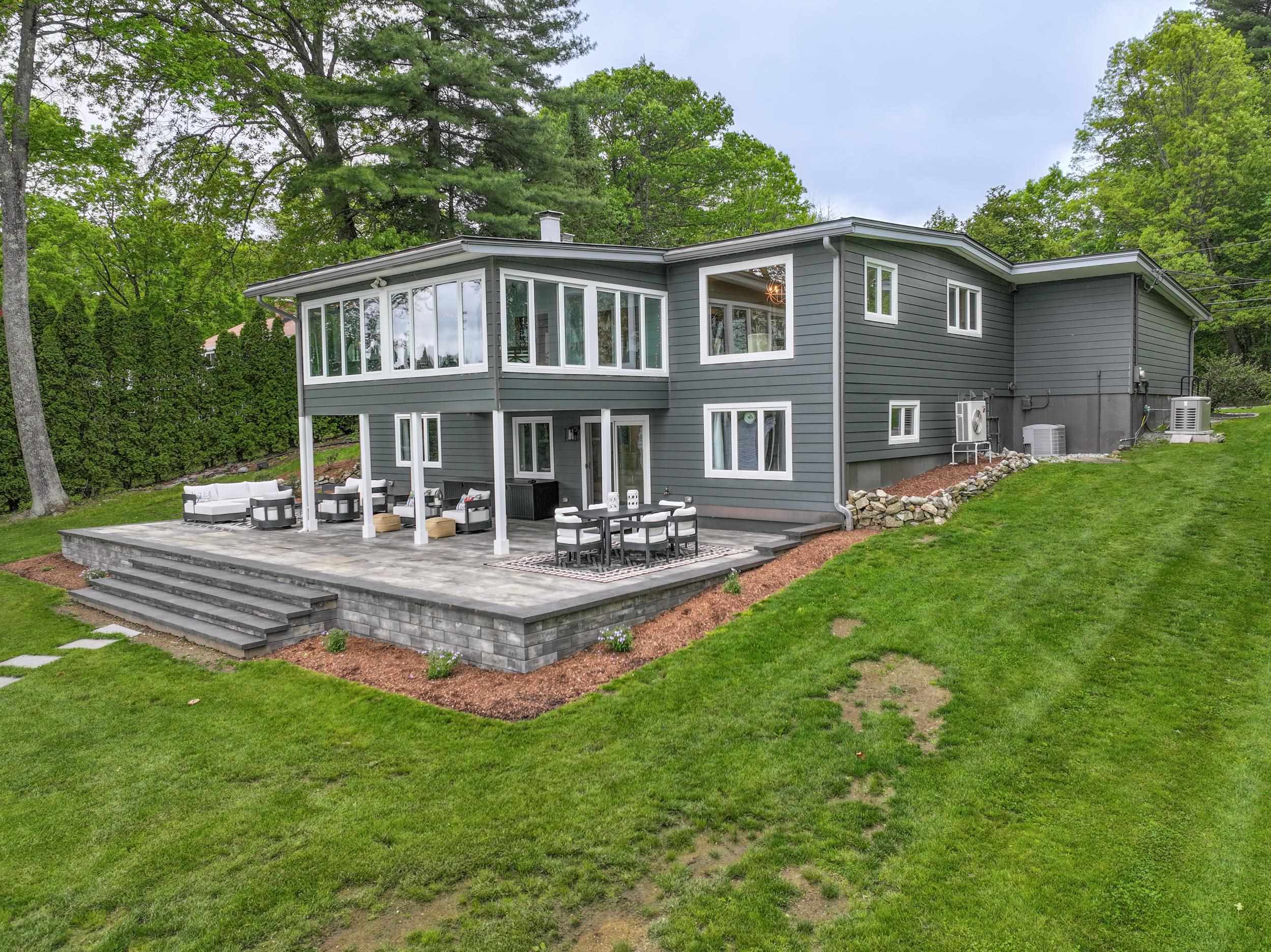 Welcome to your dream home! This beautifully updated contemporary ranch is perfectly situated on a gorgeous Canobie lakefront lot in one of the area’s most sought-after neighborhoods. With breathtaking water views, an open-concept layout, and premium upgrades throughout, this home offers the ideal blend of luxury, comfort, and style. Step inside to discover a spacious and light-filled interior featuring soaring ceilings, hardwood floors, sleek finishes, and seamless flow from the living room to the kitchen, dining area and 4 season room—perfect for entertaining or relaxing with family. Large windows fill the lake side of the house for a view from almost every room. Stunning marble fireplace with built-ins in sunken living room. The gourmet kitchen boasts high-end appliances, custom cabinetry, granite countertops, and a large island ideal for gatherings. Master suite offers updated bath and ample closet space. Large, open, walk-out basement offers additional space to entertain! Guest bedroom and office, beautiful living room with wood burning fire place, laundry and additional 1/2 bath.Many upgrades and additional features...stand-by generator, central AC, newer metal roof to name a few. Enjoy tranquil mornings and stunning sunsets from your private backyard oasis, where the lake becomes an extension of your living space. Gorgeous lot provides plenty of space for outdoor living, brand new patio, private dock and over 150 feet of lake frontage.Delayed showings until Sat 5/31.