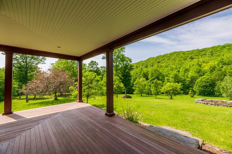 large wrap around porch off of the kitchen, perfect for grilling or relaxing