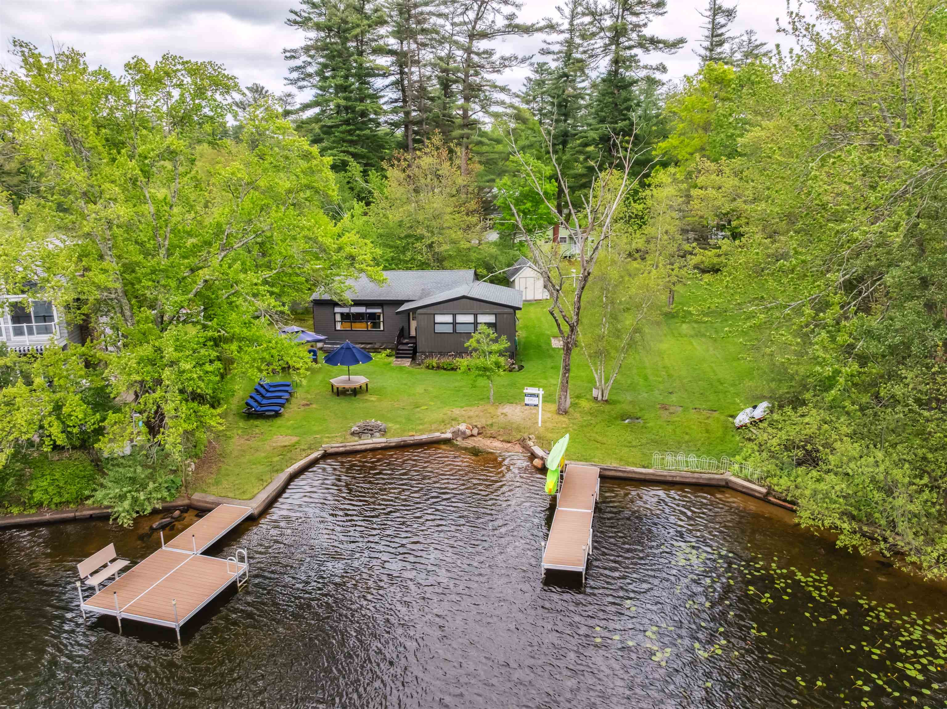 A once-in-a-generation opportunity to own two adjoining parcels on the peaceful shores of the highly sought-after Cobbett's Pond in Windham, New Hampshire. Just 37 miles from Boston, this unique property offers 110 feet of prime water frontage with endless potential - whether you to choose to renovate the charming season cottage to preserve the nostalgic charm of lakeside summers past or design and build your dream home or family compound to enjoy for generations to come. With breathtaking views and direct access to the water, the setting is ideal for swimming, boating, waterskiing or simply soaking in the serenity of one of Southern New Hampshire most desirable lakes. Cottage is being sold as is. Buyer is responsible to do their own due diligence and obtaining any approvals.