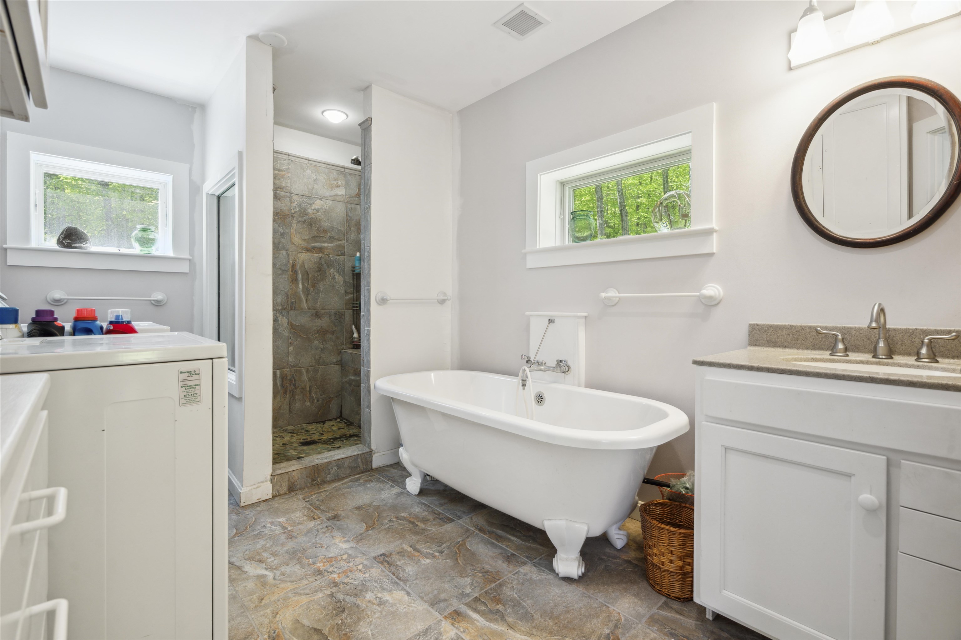 Tile stall shower, footed tub and laundry