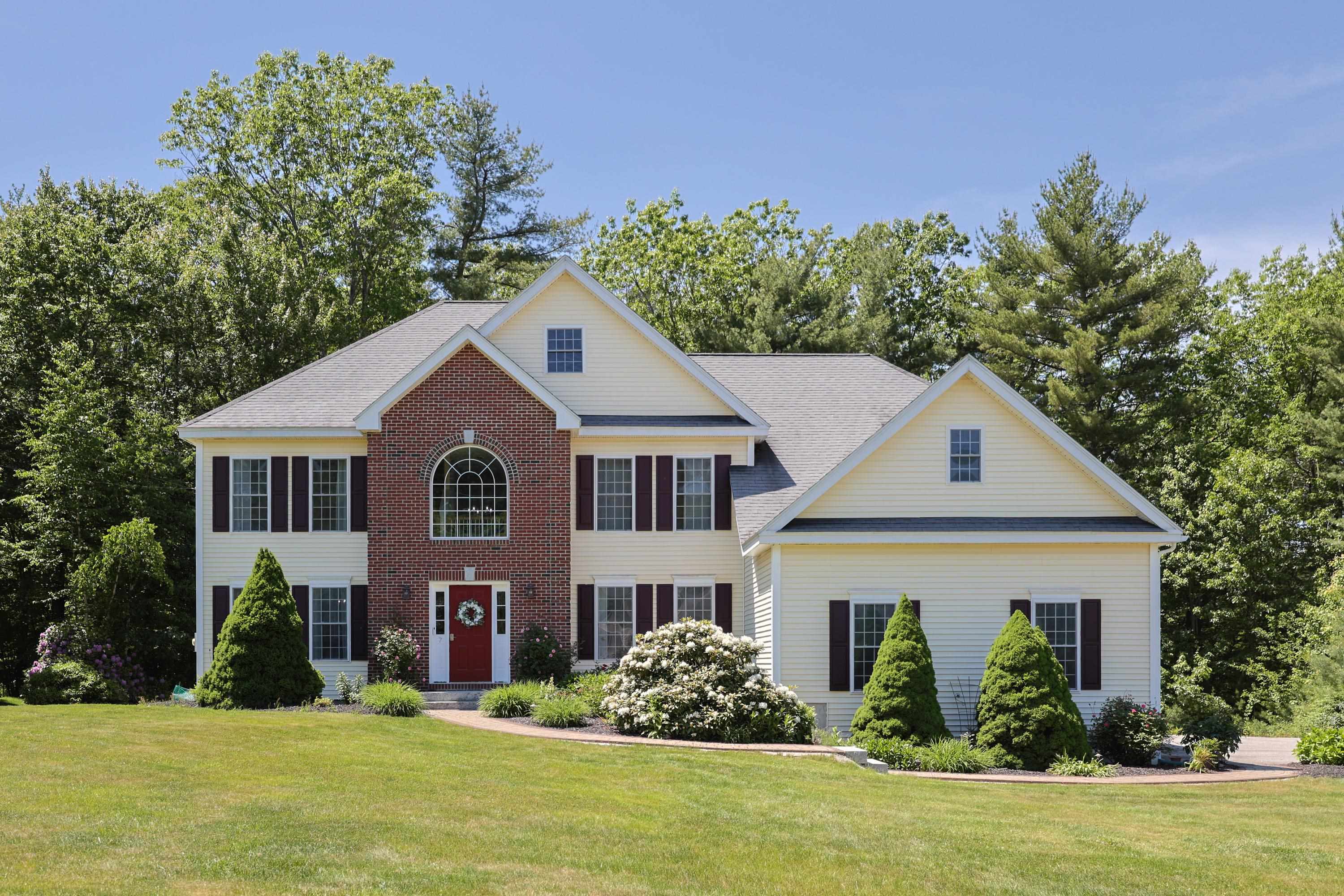 Now available in Nashua’s premier neighborhood, Chesson Run— this elegant brick-front Colonial is set on 1.42 private acres. With hardwood floors throughout, the main level welcomes you with a sun-drenched living room that flows seamlessly into a formal dining area and an open-concept kitchen—ideal for both daily life and entertaining. A dedicated 1st floor office offers the perfect work-from-home setup, while the spacious family room features soaring cathedral ceilings and a fireplace - the perfect atmosphere for gathering. The first floor also includes a half bath, laundry area, and a breakfast nook that opens onto a new composite deck—your own peaceful retreat overlooking your private woods. Upstairs, the expansive primary suite features a spa-like bath with a walk-in shower, Jacuzzi tub, walk-in closet, and a bonus room perfect for a nursery, yoga space, or dressing room. Three additional bedrooms share a full bath, and a walk-up attic offers future potential for even more living space. Downstairs, the finished lower level adds versatile space for entertaining, recreation, or guests with a full bath and separate bedroom space. The beautiful landscaping, patio and walkways welcome you to enjoy the outdoors and the 3 car garage has plenty of room for all your toys. This area is uniquely located close to route 3 and 101a amenities yet tucked in a quiet and elite neighborhood surrounded by trees. A true oasis in North Nashua! Showings begin at the open house Saturday 10:30-12