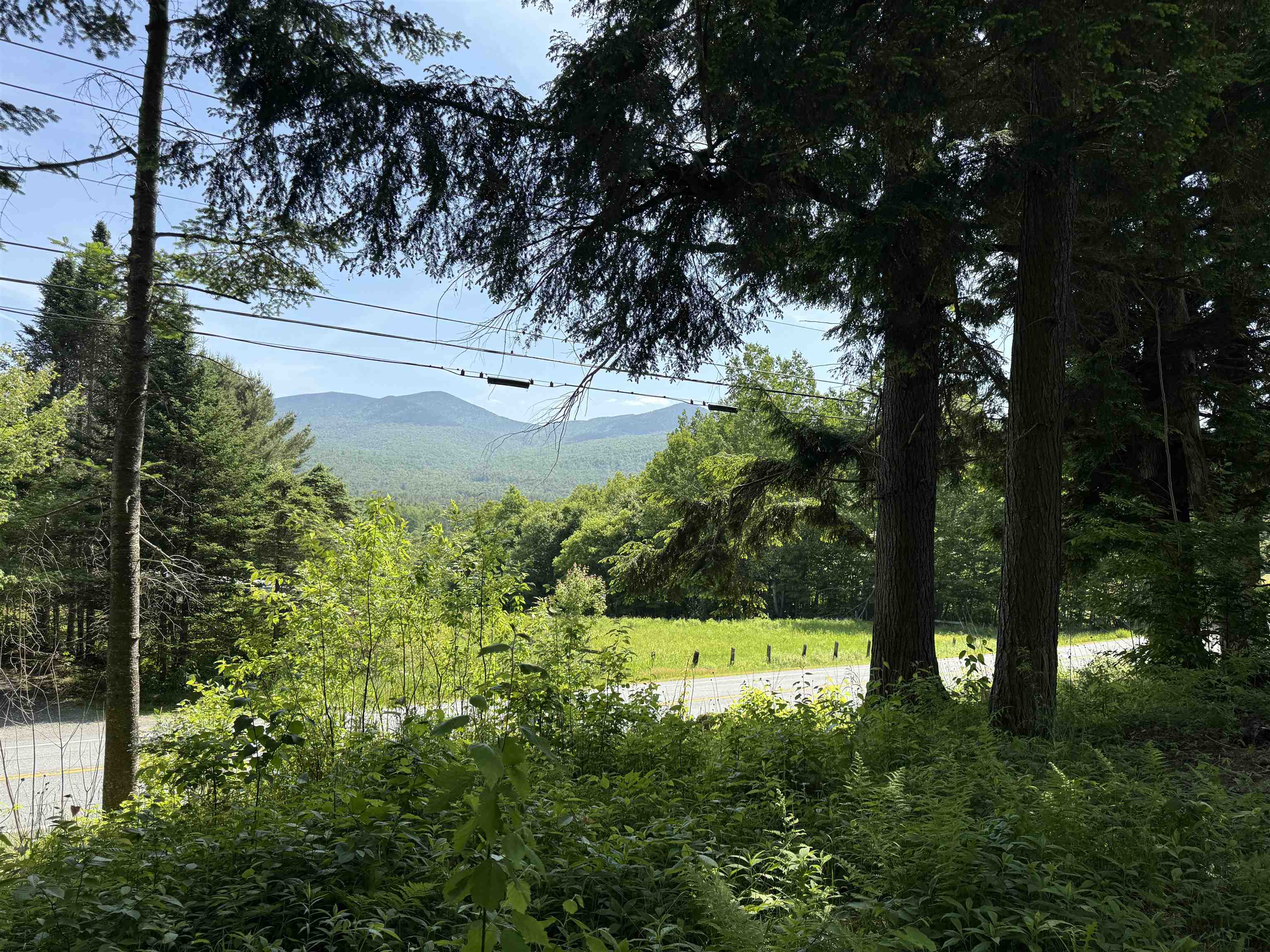 Great location for your primary residence or vacation get-away in the Northeast Kingdom with over 640' of frontage on Route 102.  This 12.1 acre lot offers a level building area, 2 car garage built in 1991, drilled well, power (not connected).  Perc test has been completed and property will support a conventional septic system.  A mobile home circa 1980s was removed from property in 2016.  There is a nice view to the East of the local NH mountains.  The land is nearby to several outdoor activities including snowmoibling with access through the neighbor's property with permission.  Not far away is access to the Connecticut River Paddler's Trail which is part of the Northern Forest Canoe Trail.  Do you love to ride ATVs?  The Ride the Wilds Trail trail access is in nearby North Stratford, NH.  Fishing & boating opportunities at nearby Maidstone Lake and many other ponds and streams.  Do not miss this opportunity to own a large parcel that is partially developed with lots of potential.
