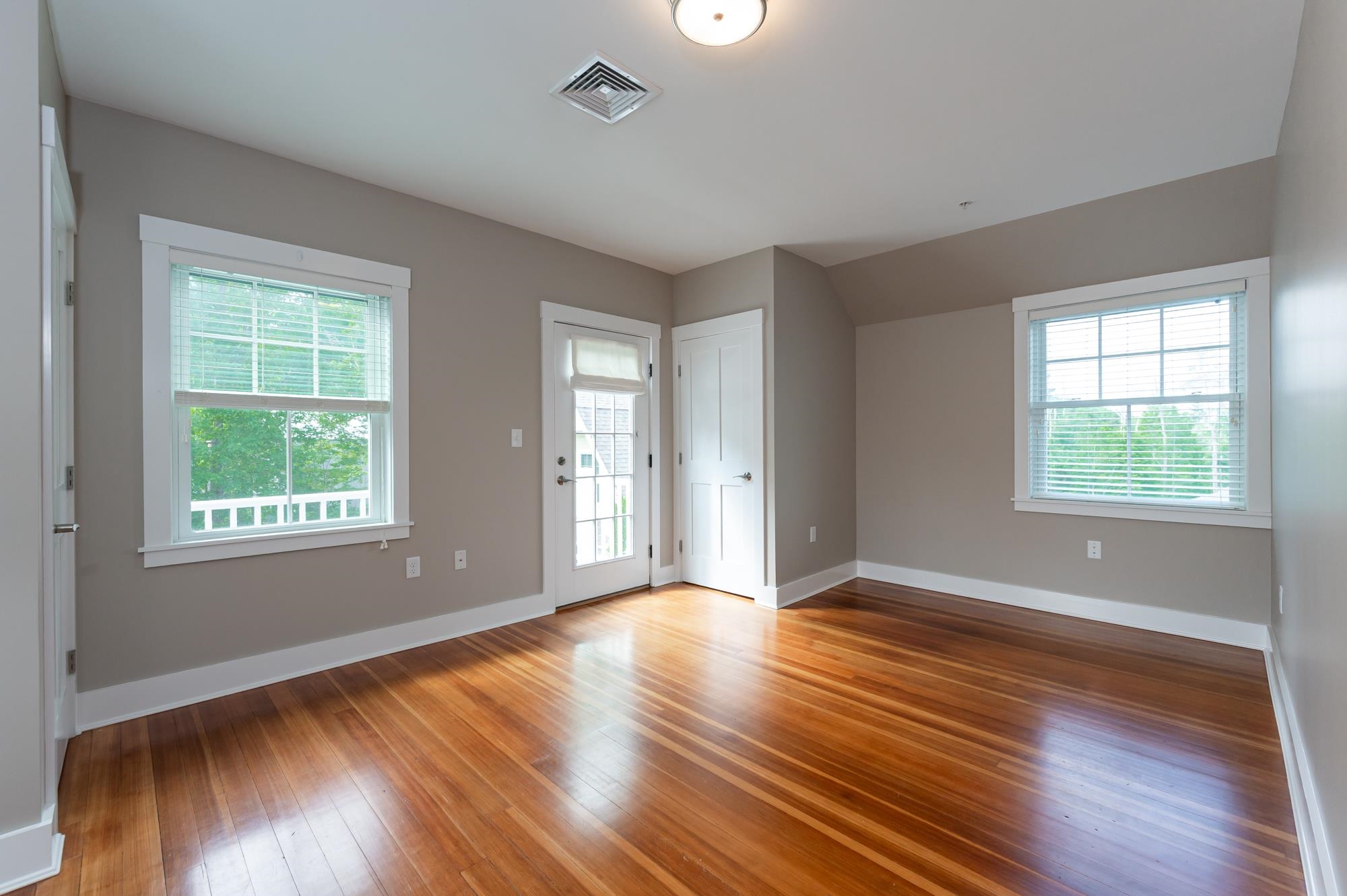 Primary bedroom suite with balcony