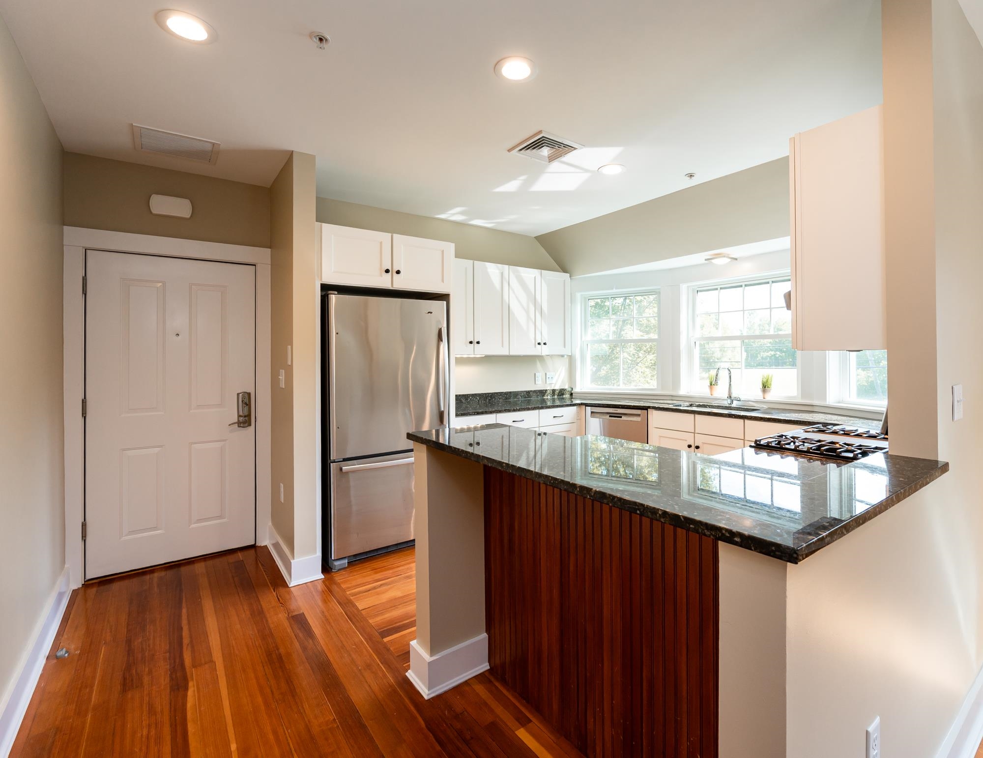 Wraparound kitchen with raised counter seating nook